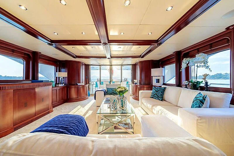 a living room with a large window aboard BANG! Yacht for Charter