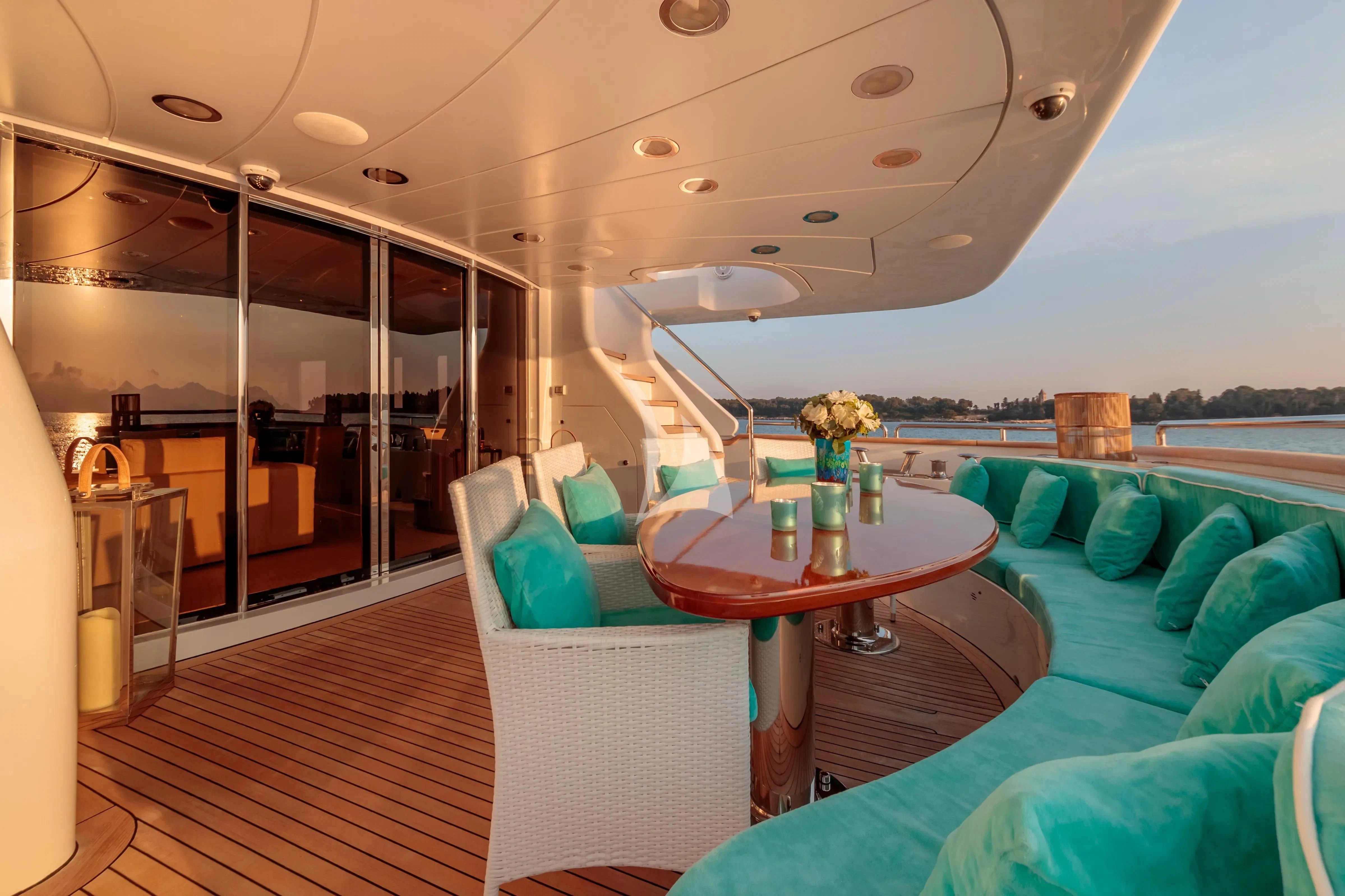 a room with a table and chairs aboard BANG! Yacht for Charter
