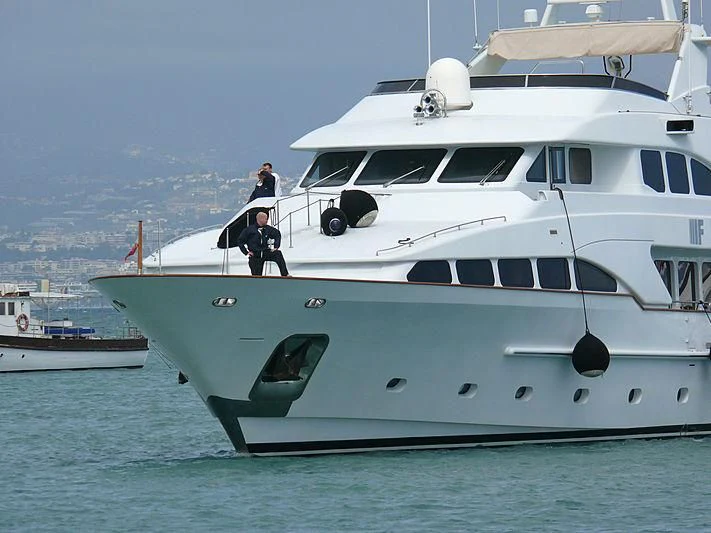 two men standing on a boat aboard BANG! Yacht for Charter