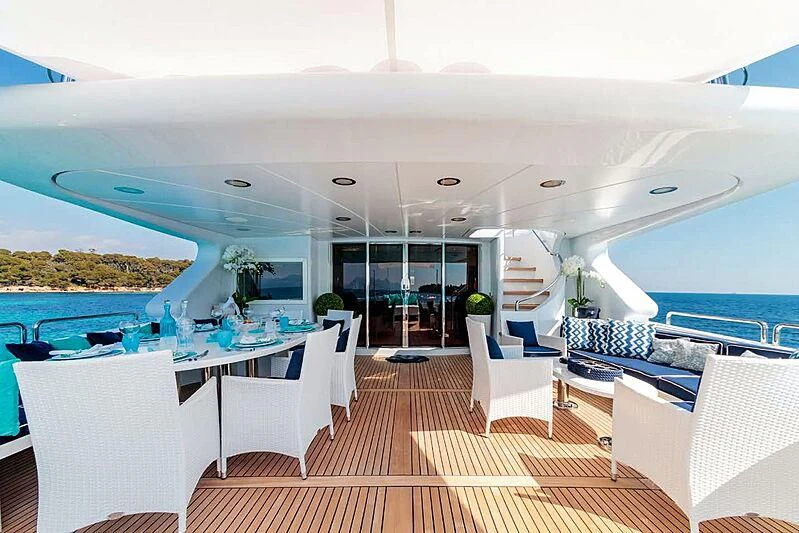 a room with a pool and a deck aboard BANG! Yacht for Charter