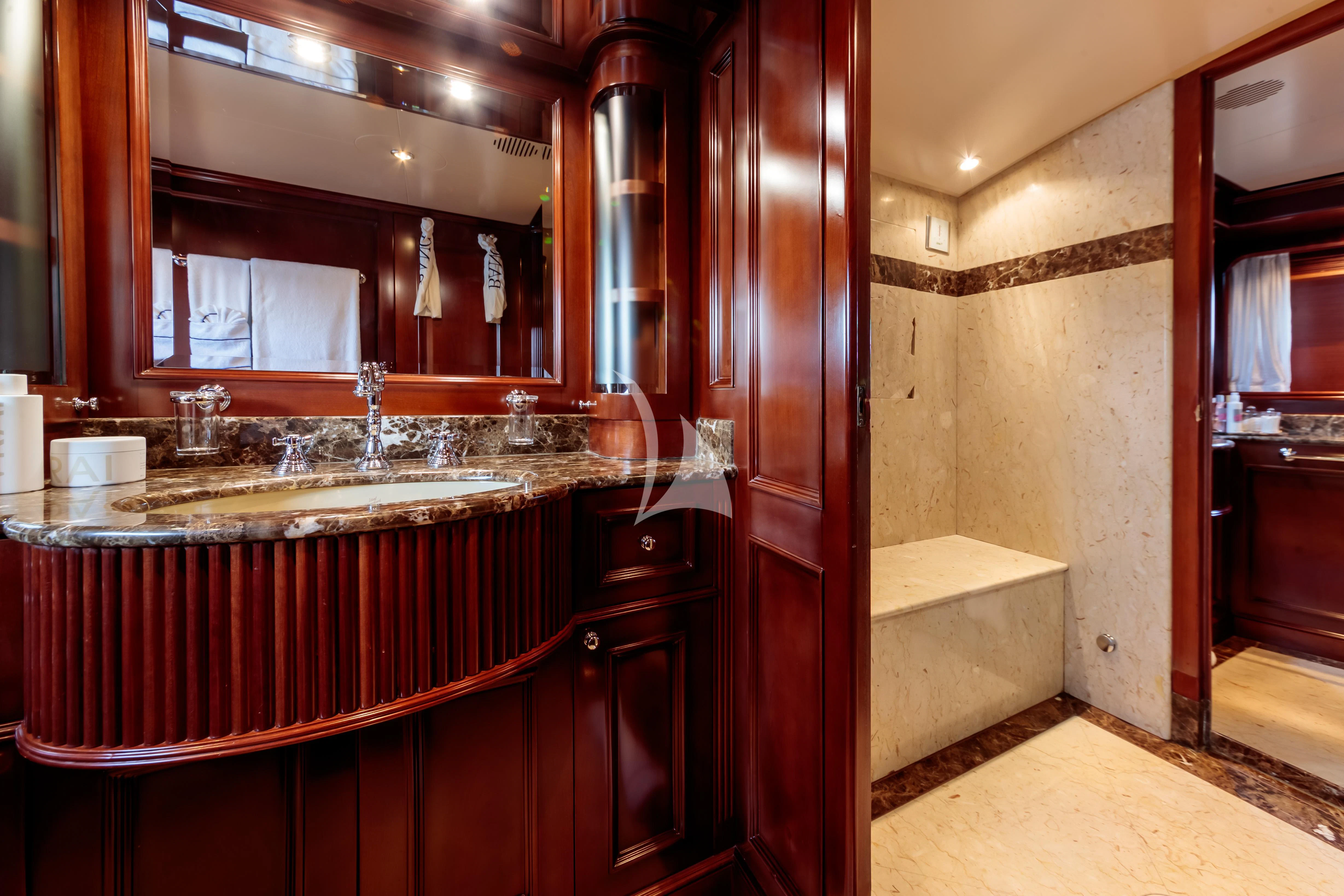 a kitchen with wooden cabinets aboard BANG! Yacht for Charter