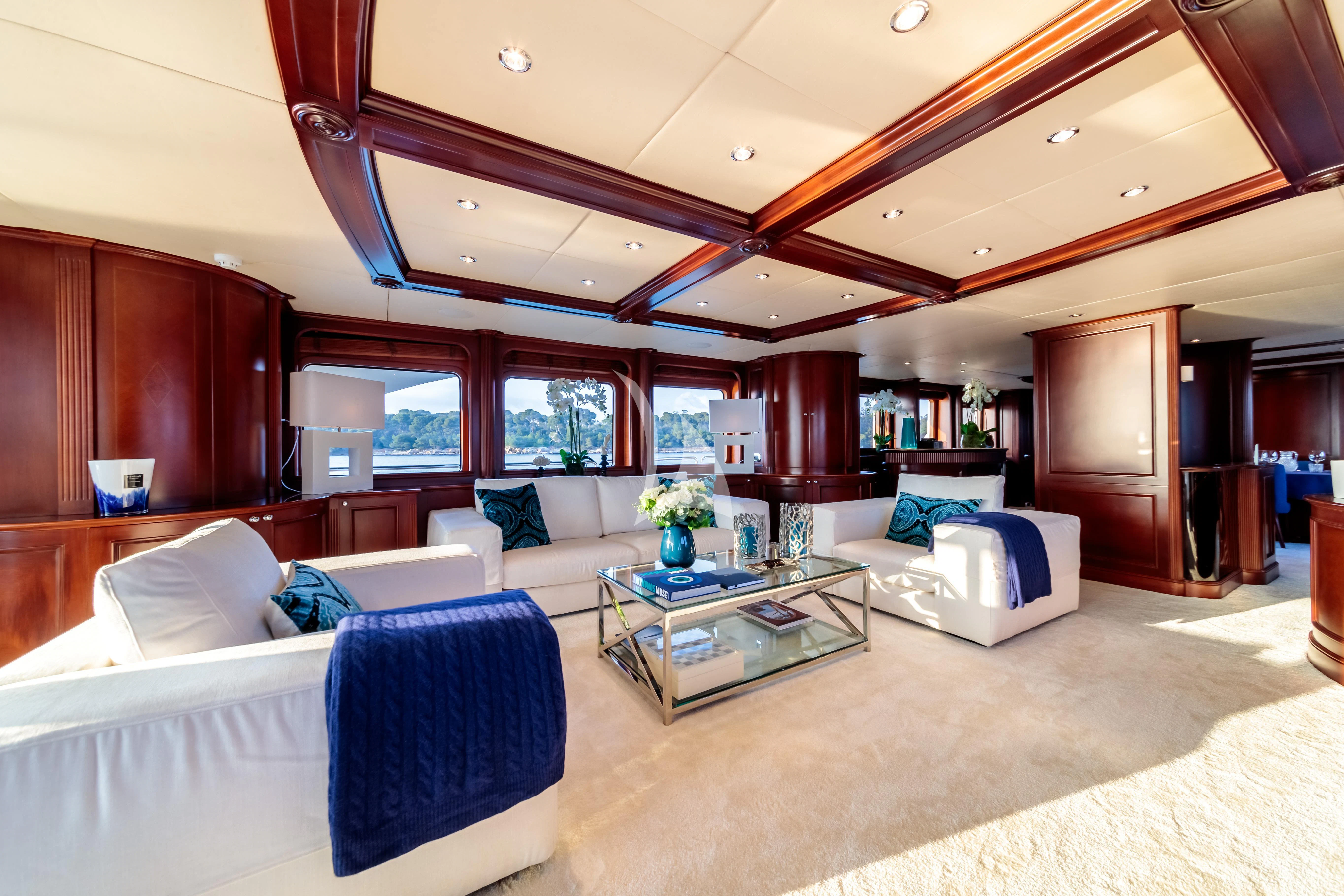 a living room with a large open floor plan aboard BANG! Yacht for Charter