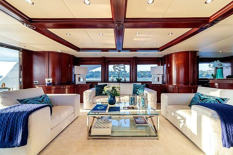 a living room with a large window aboard BANG! Yacht for Charter