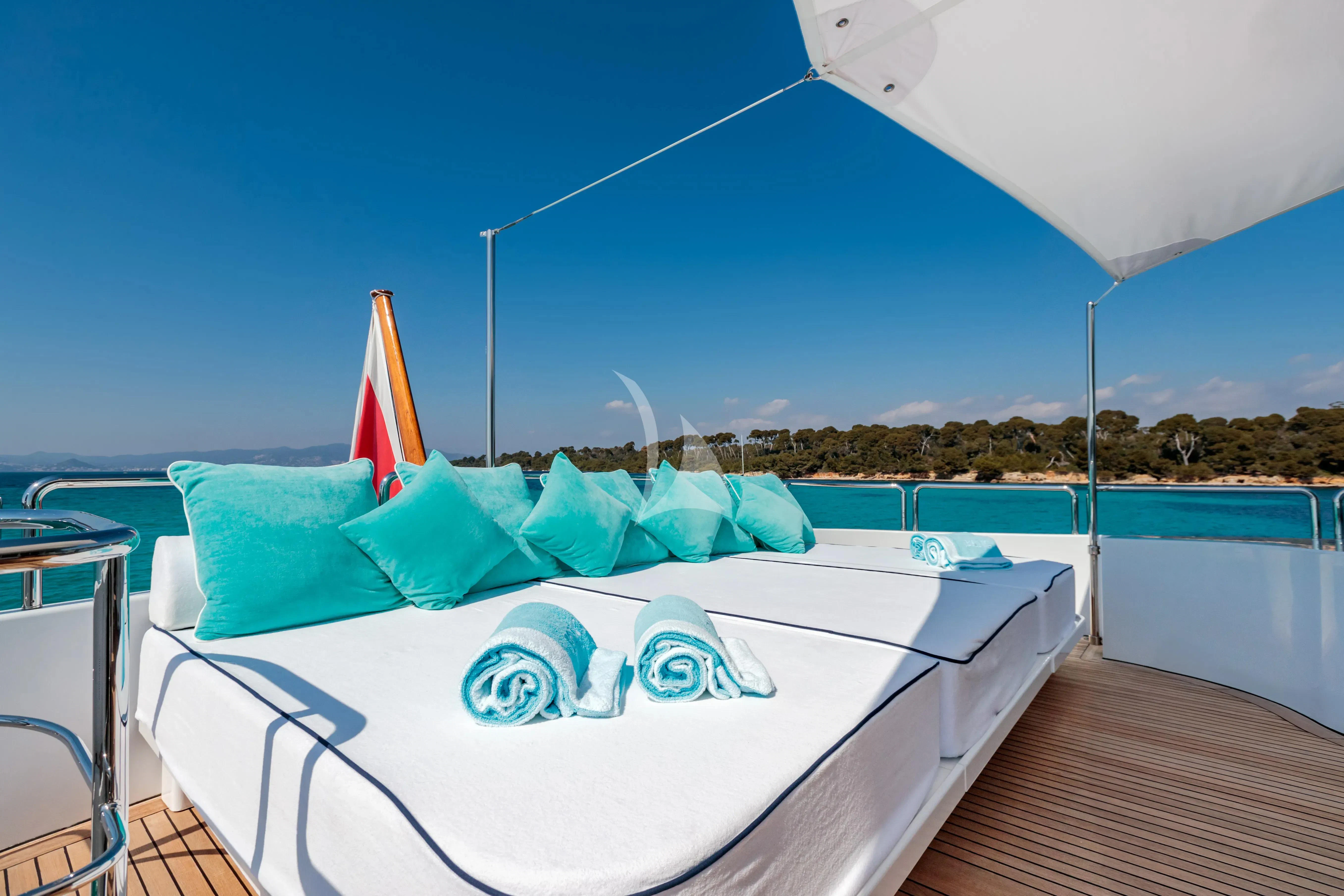 a pool with a large umbrella aboard BANG! Yacht for Charter