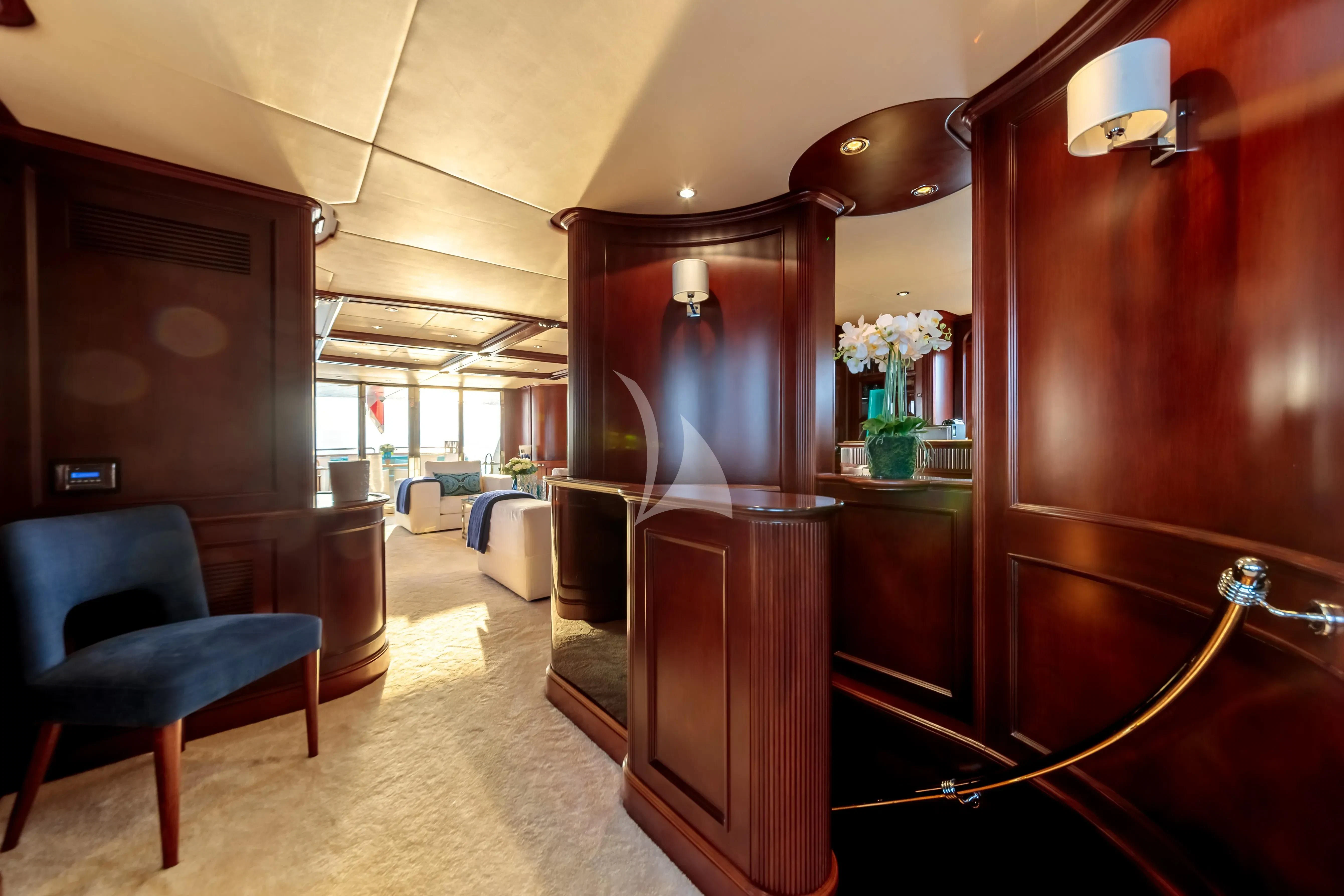 a room with a chair and a desk aboard BANG! Yacht for Charter