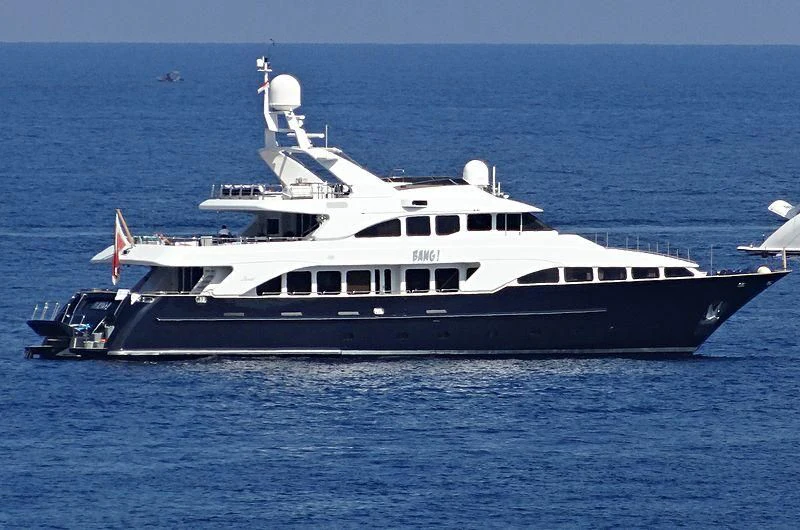 a large white yacht in the water aboard BANG! Yacht for Charter