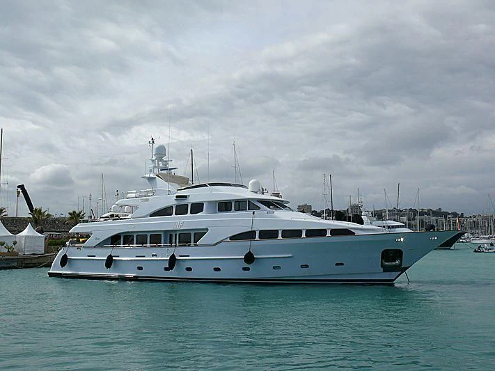 a white boat in the water aboard BANG! Yacht for Charter