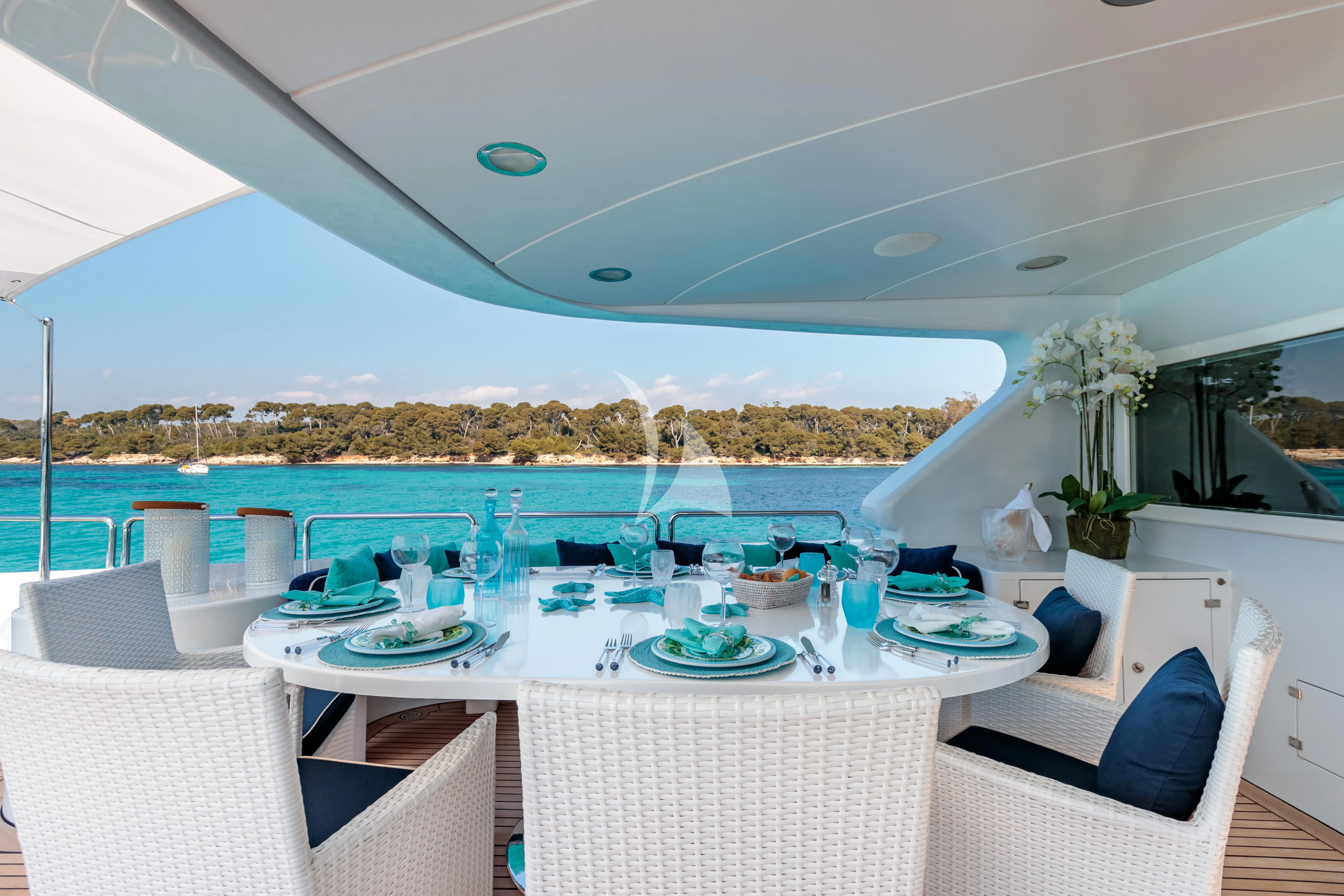 a table set for a meal aboard BANG! Yacht for Charter