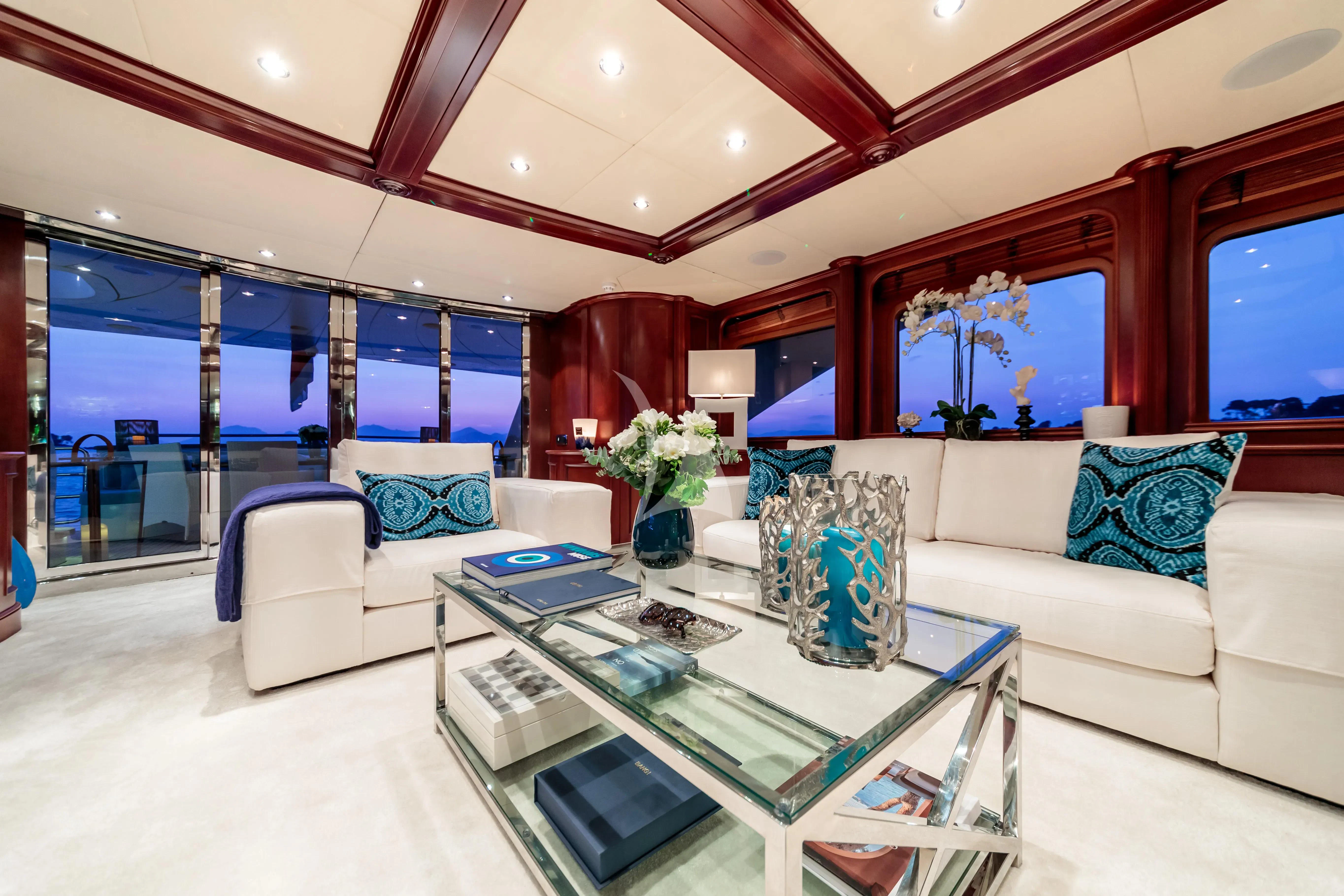 a living room with a large window aboard BANG! Yacht for Charter