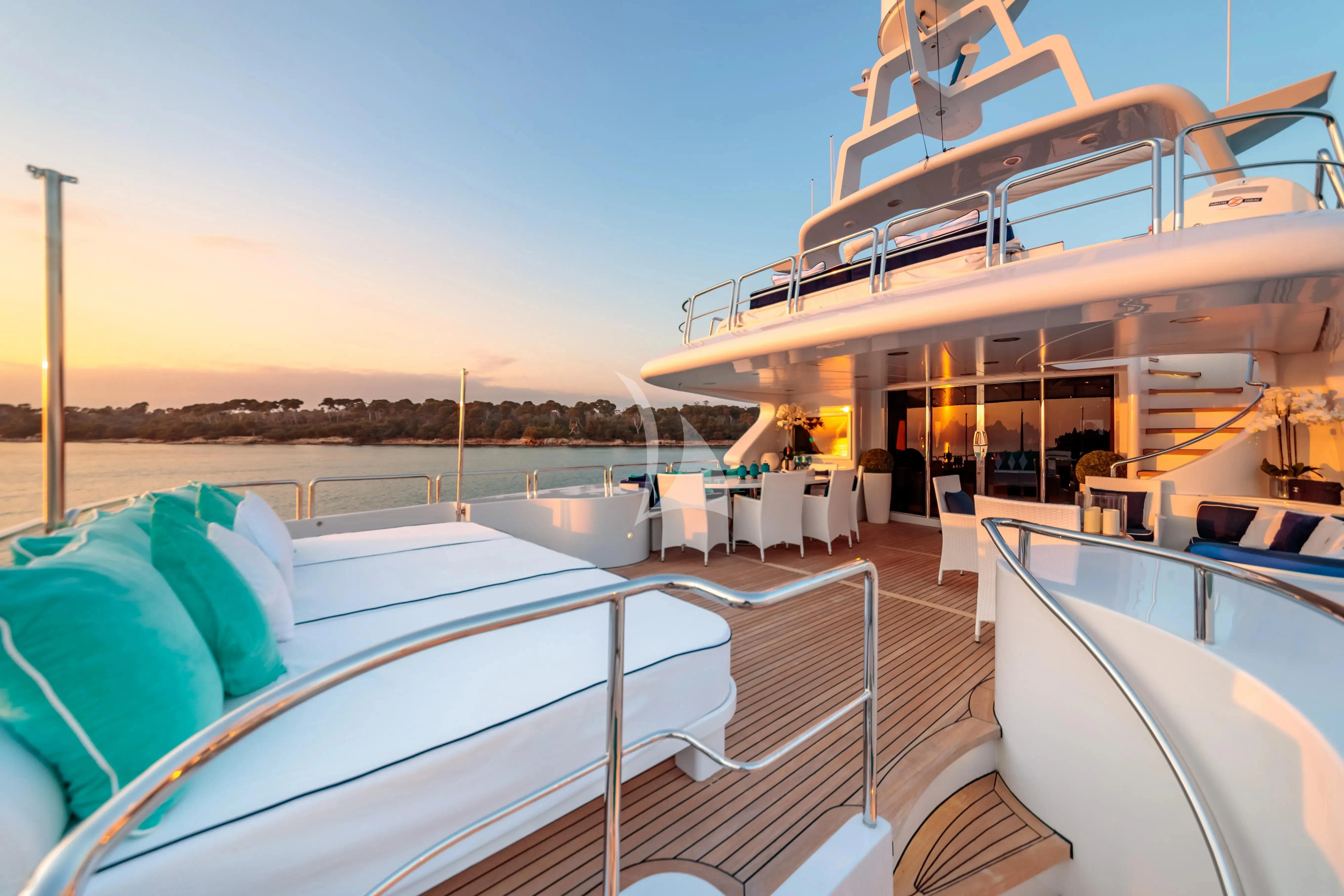 a large white boat on a body of water aboard BANG! Yacht for Charter