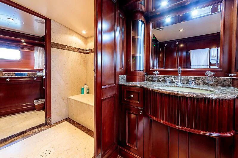 a bathroom with a large mirror aboard BANG! Yacht for Charter