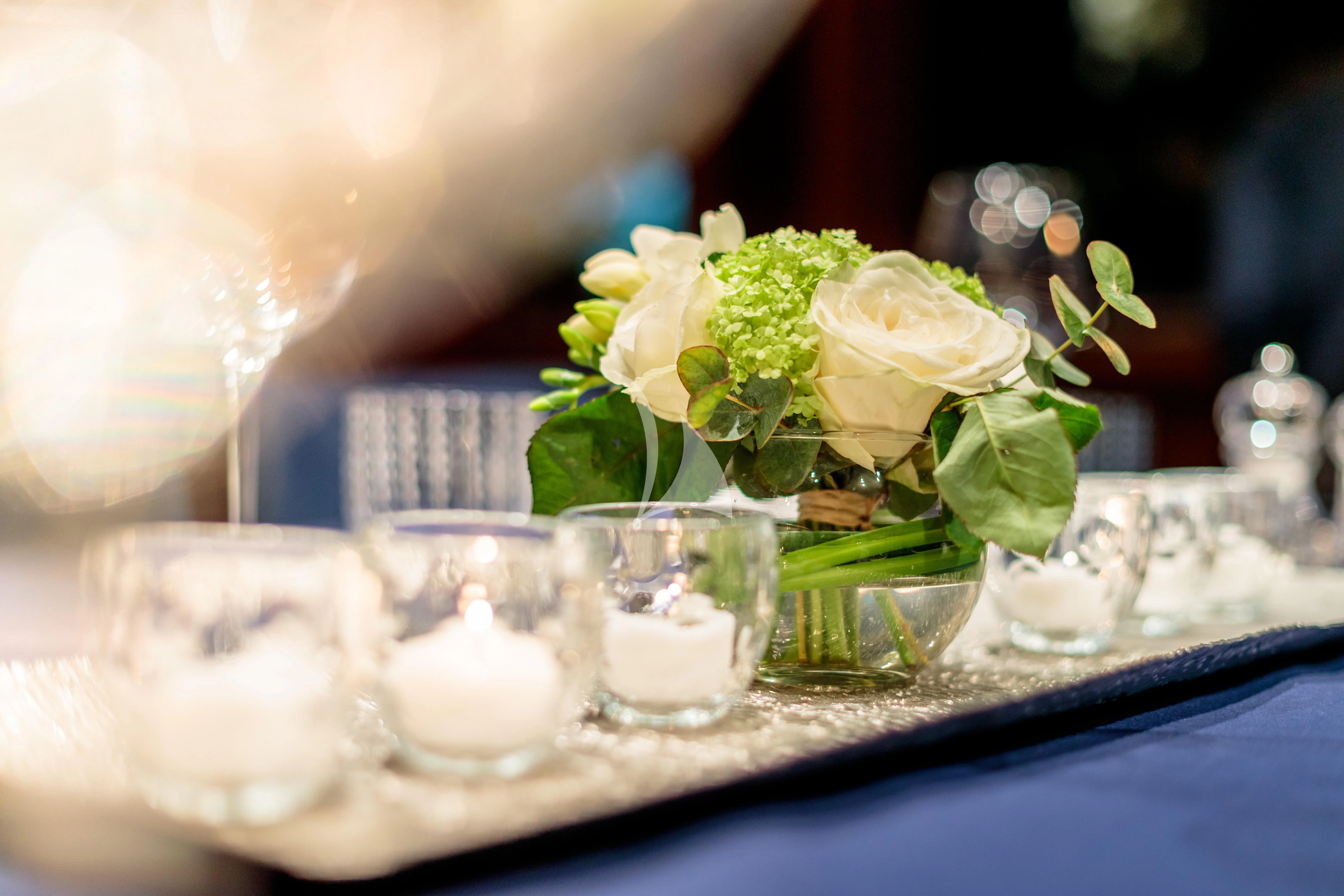 a vase of flowers sits on a table aboard BANG! Yacht for Charter