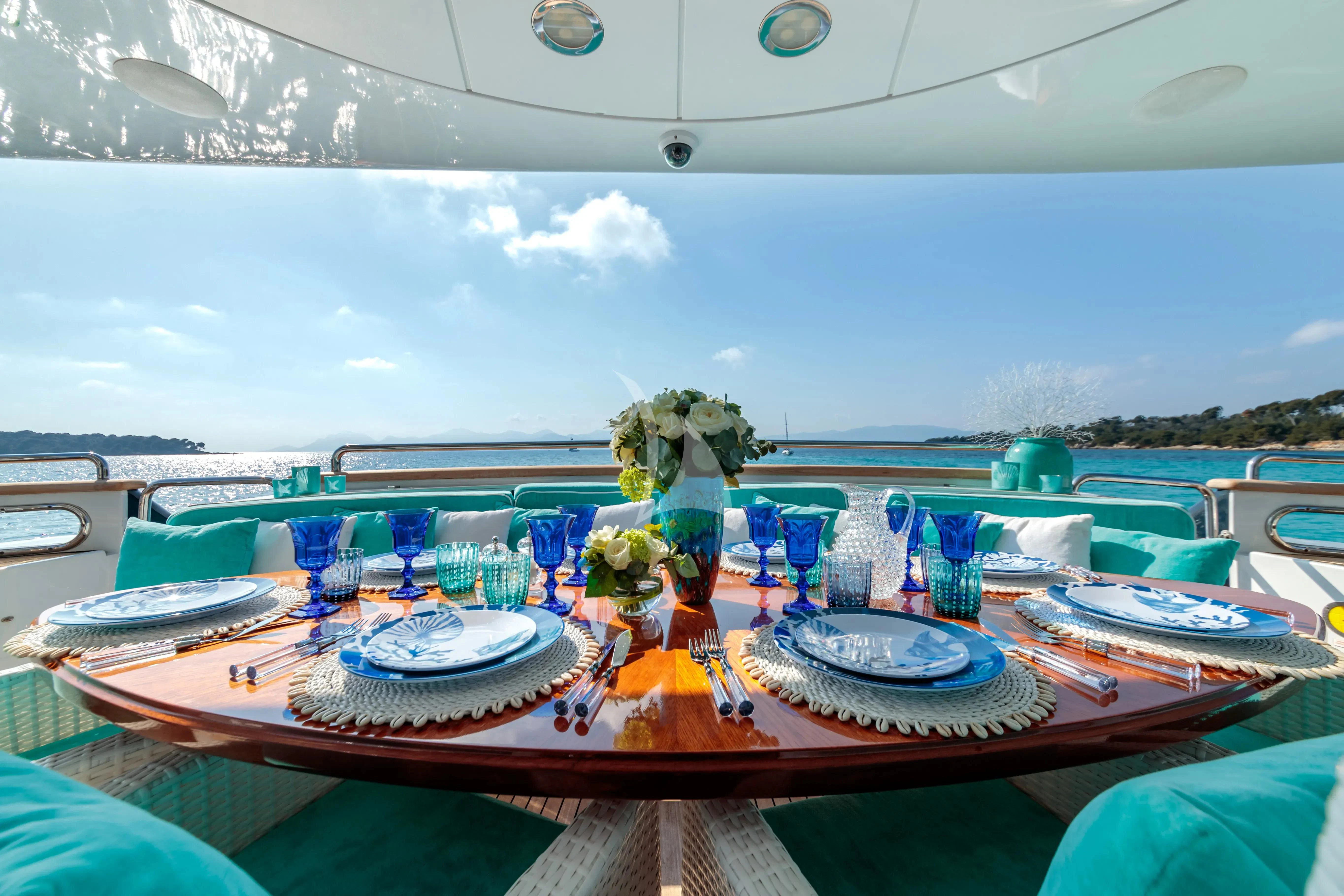 a table with plates and glasses on it aboard BANG! Yacht for Charter
