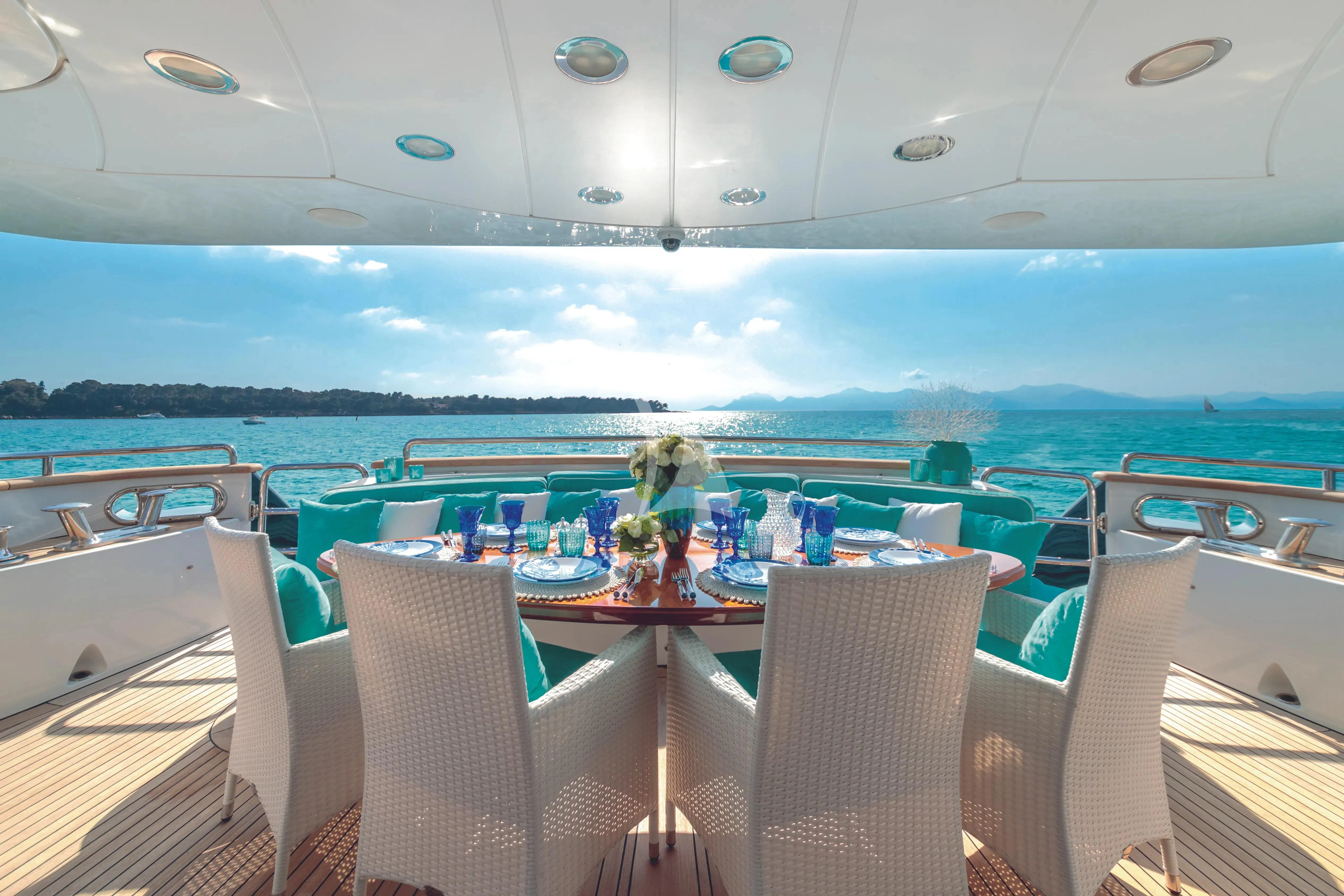 a table set for a meal on a boat aboard BANG! Yacht for Charter