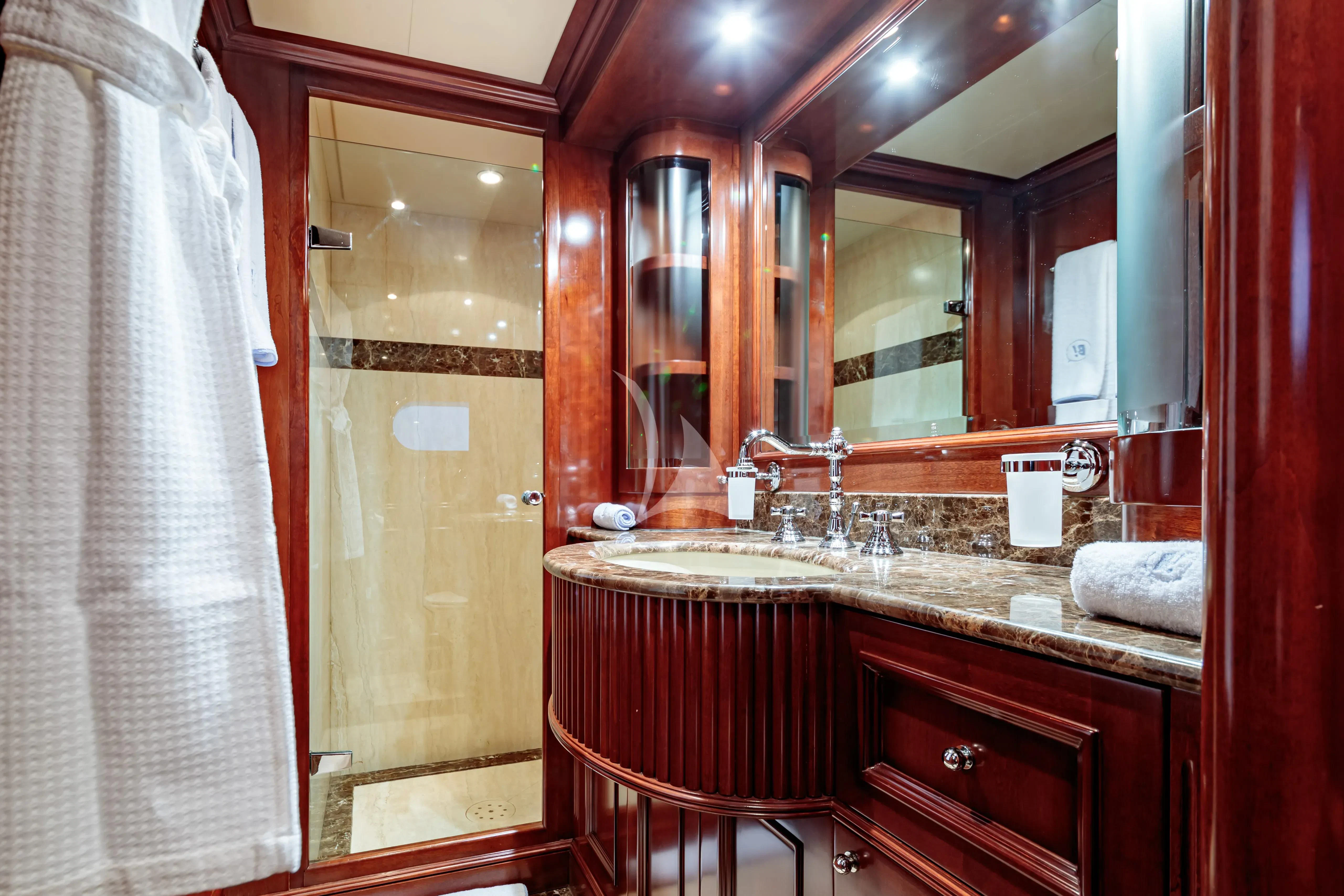 a bathroom with a large mirror aboard BANG! Yacht for Charter