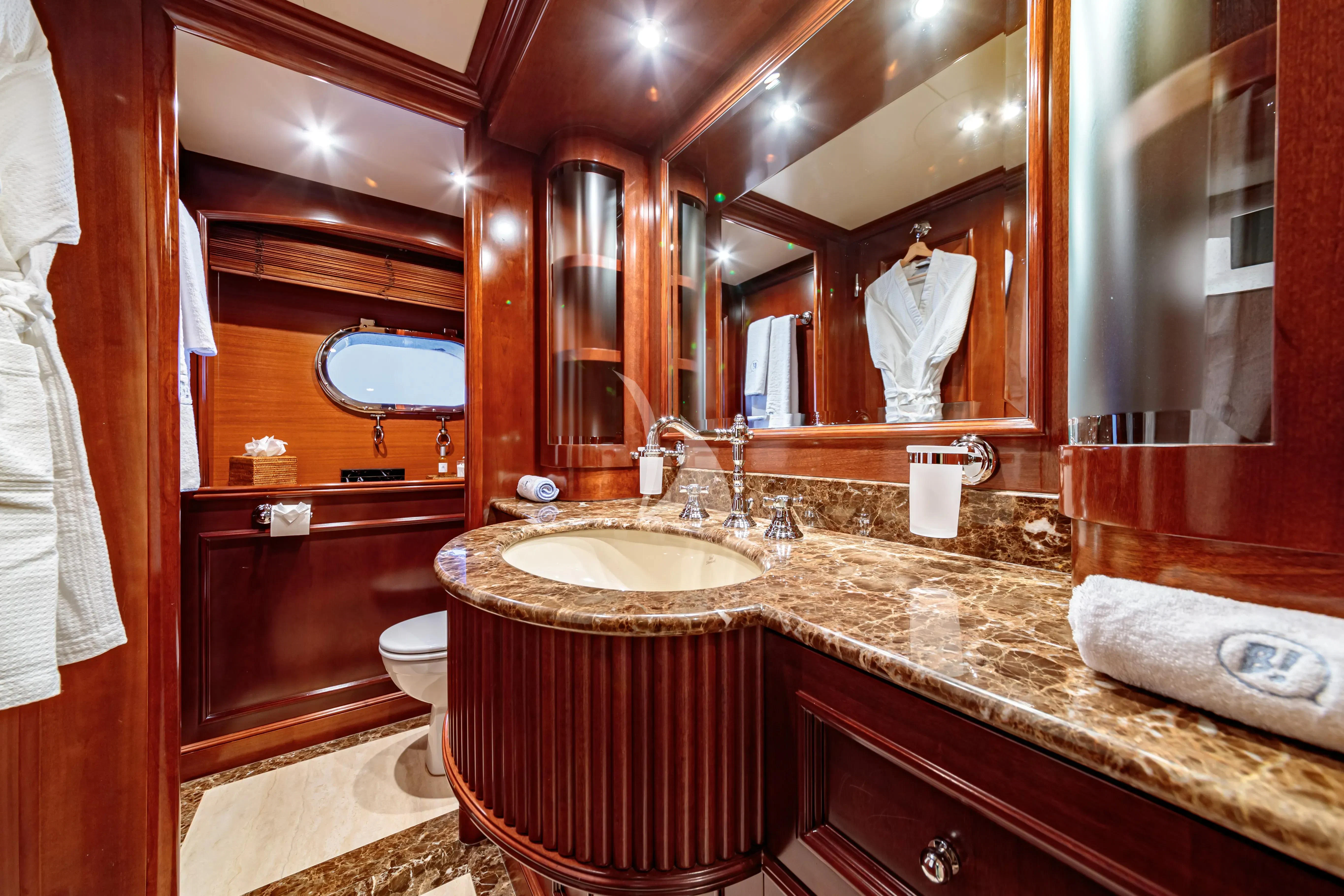 a bathroom with a large mirror aboard BANG! Yacht for Charter