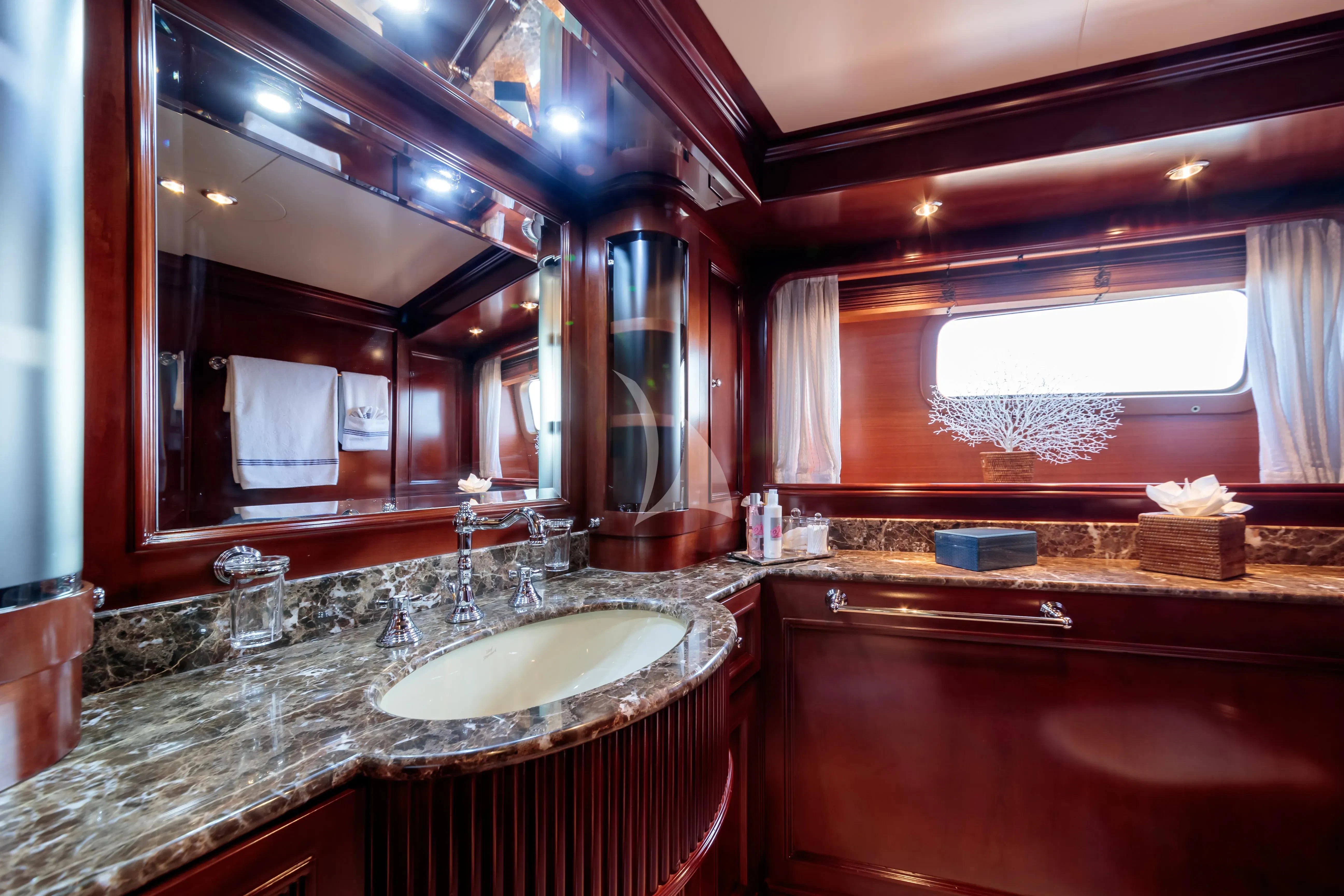a bathroom with a large mirror aboard BANG! Yacht for Charter