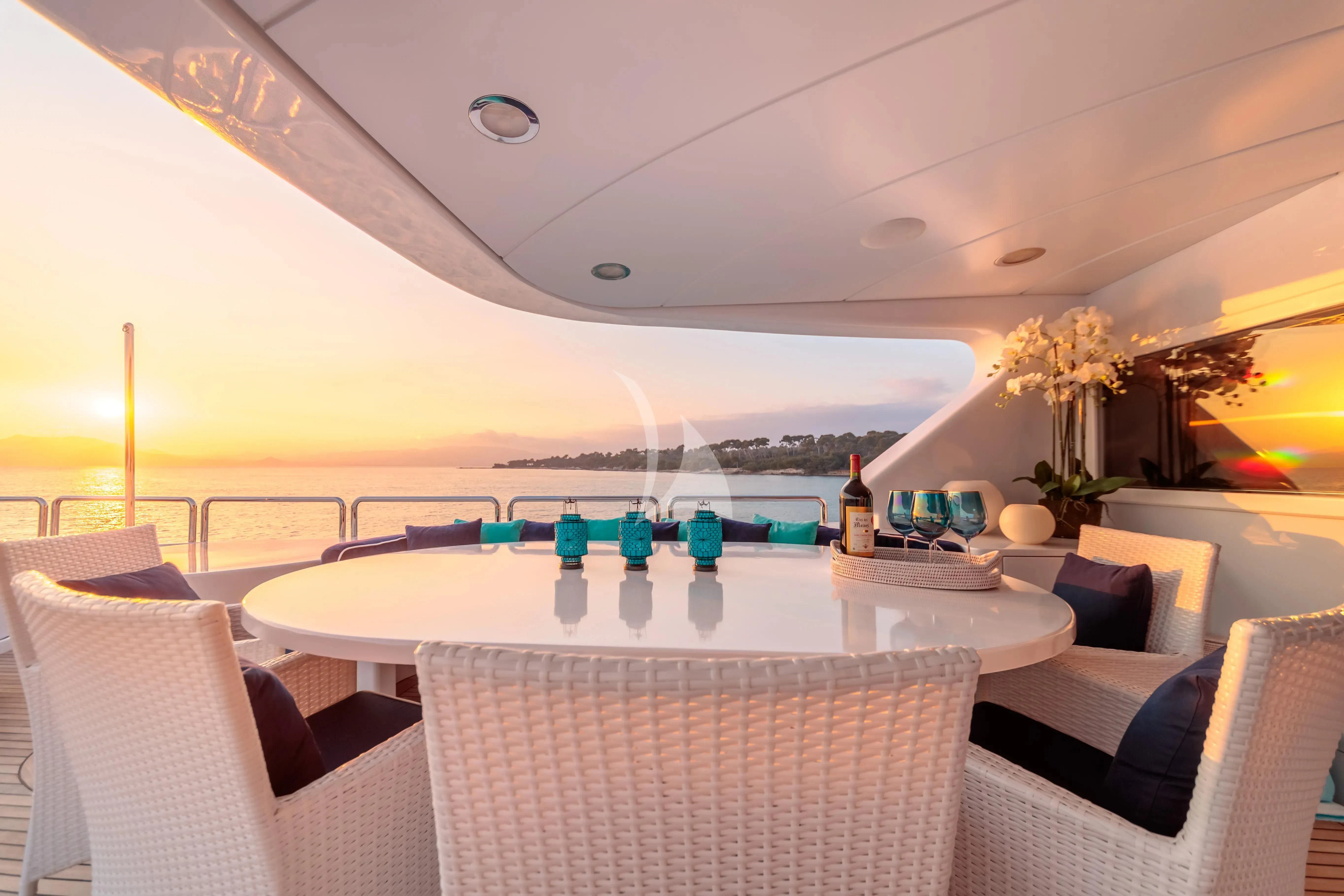 a room with a table and chairs aboard BANG! Yacht for Charter
