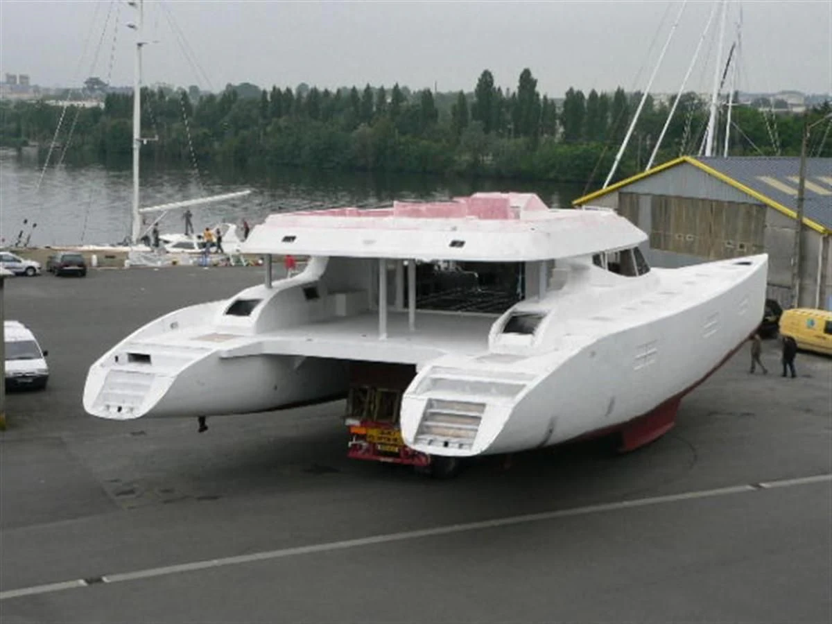 a white boat on a trailer aboard 85' 2008 YAPLUKA 85 DOUBLE DECK Yacht for Sale