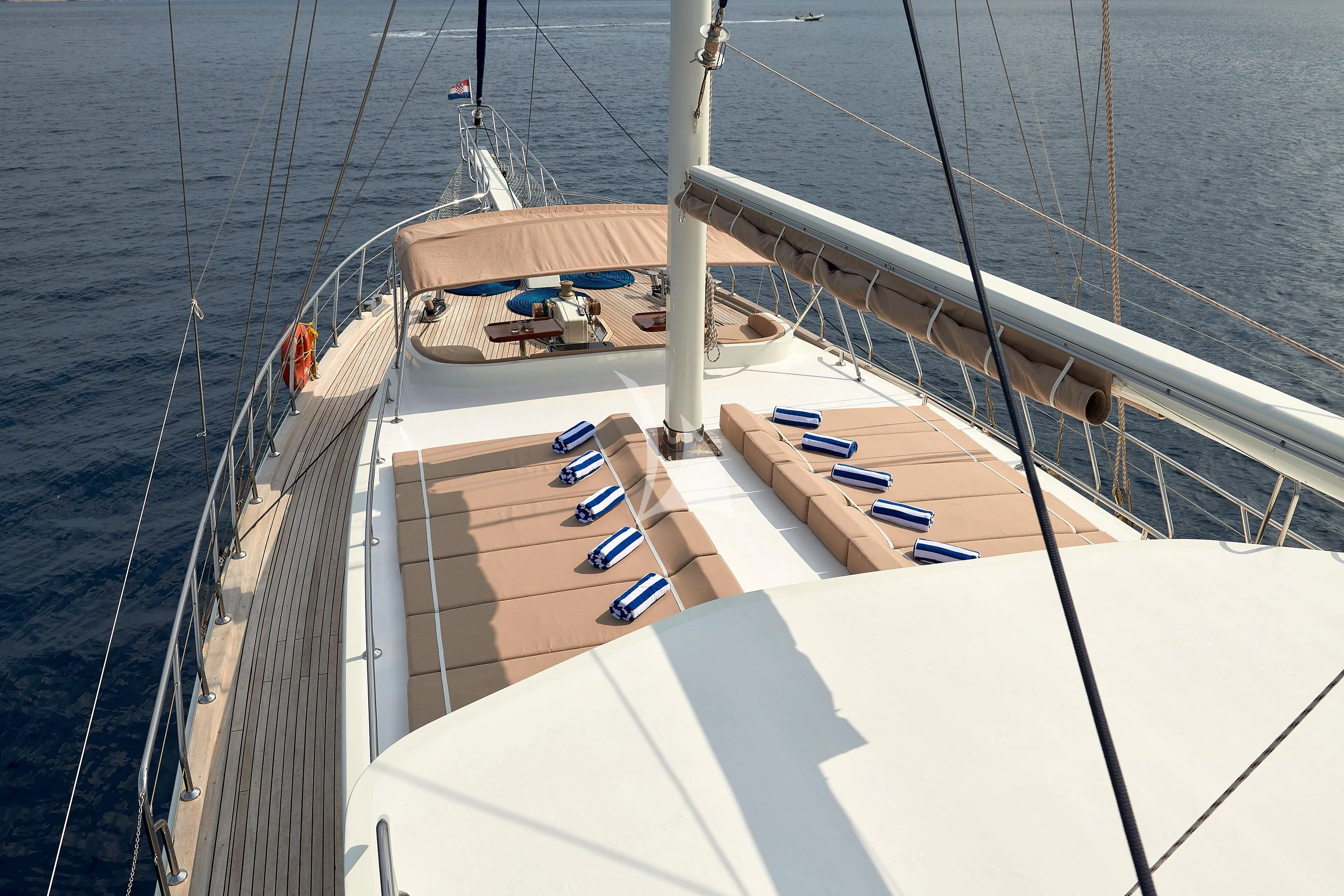 a large ship with a deck aboard SEA BREEZE Yacht for Charter