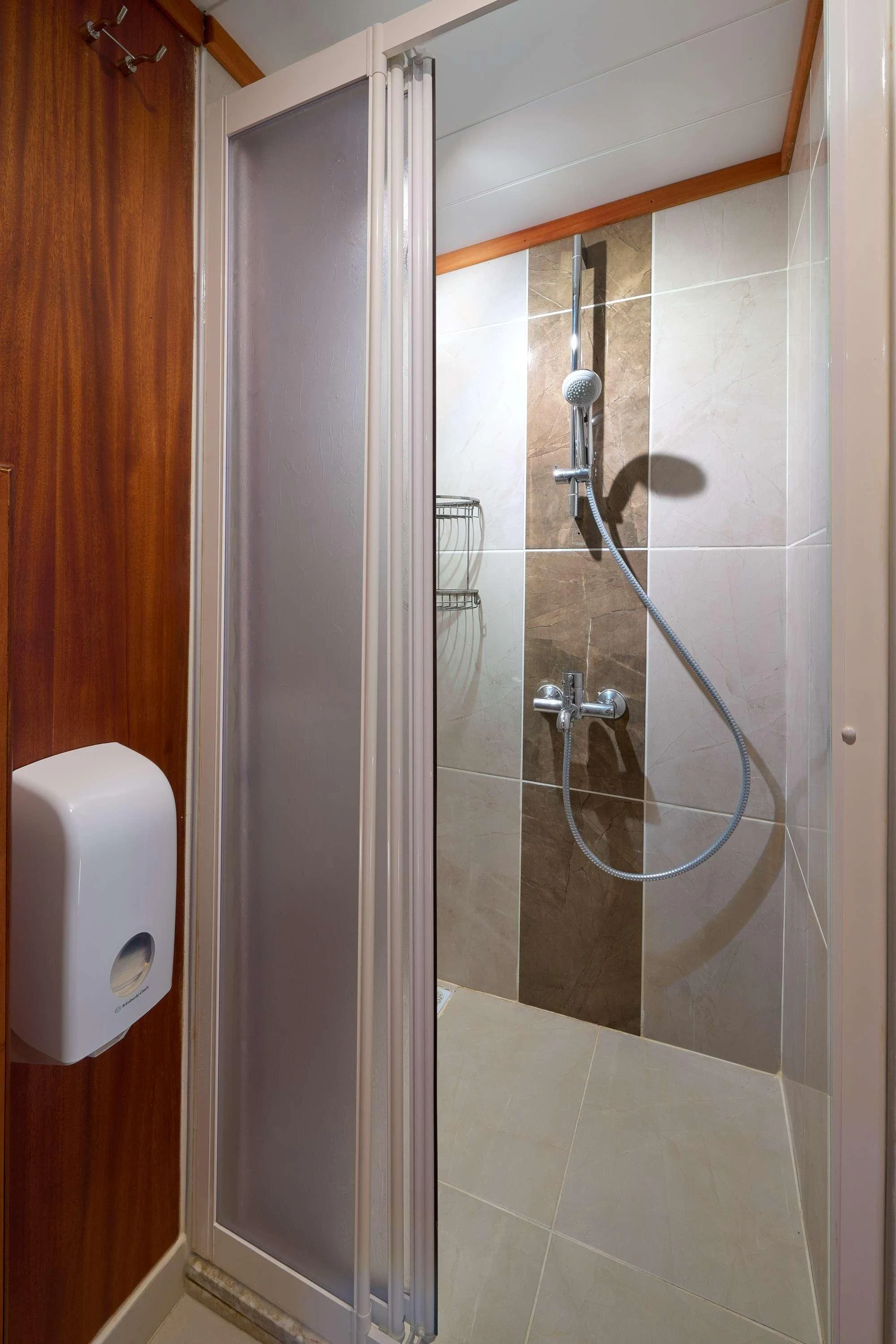 a bathroom with a shower unit aboard SEA BREEZE Yacht for Charter