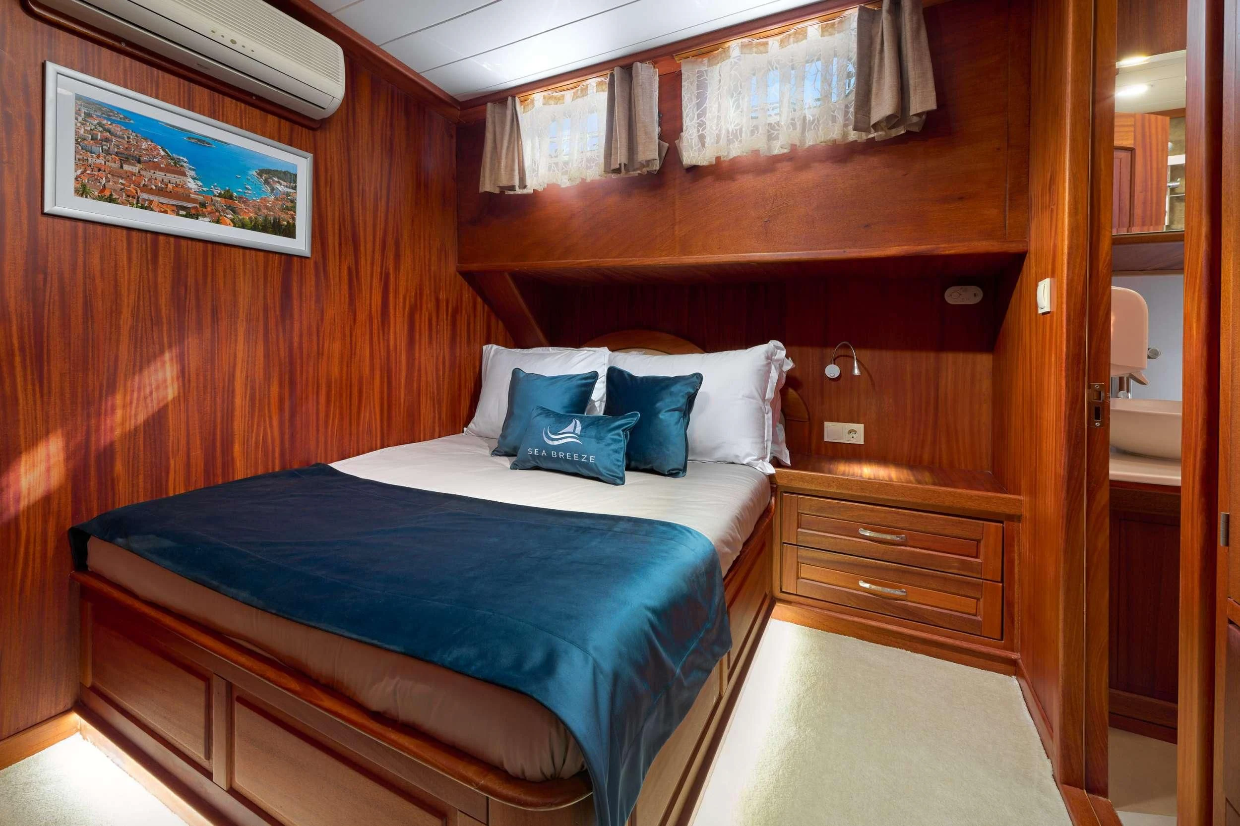 a bed in a room aboard SEA BREEZE Yacht for Charter