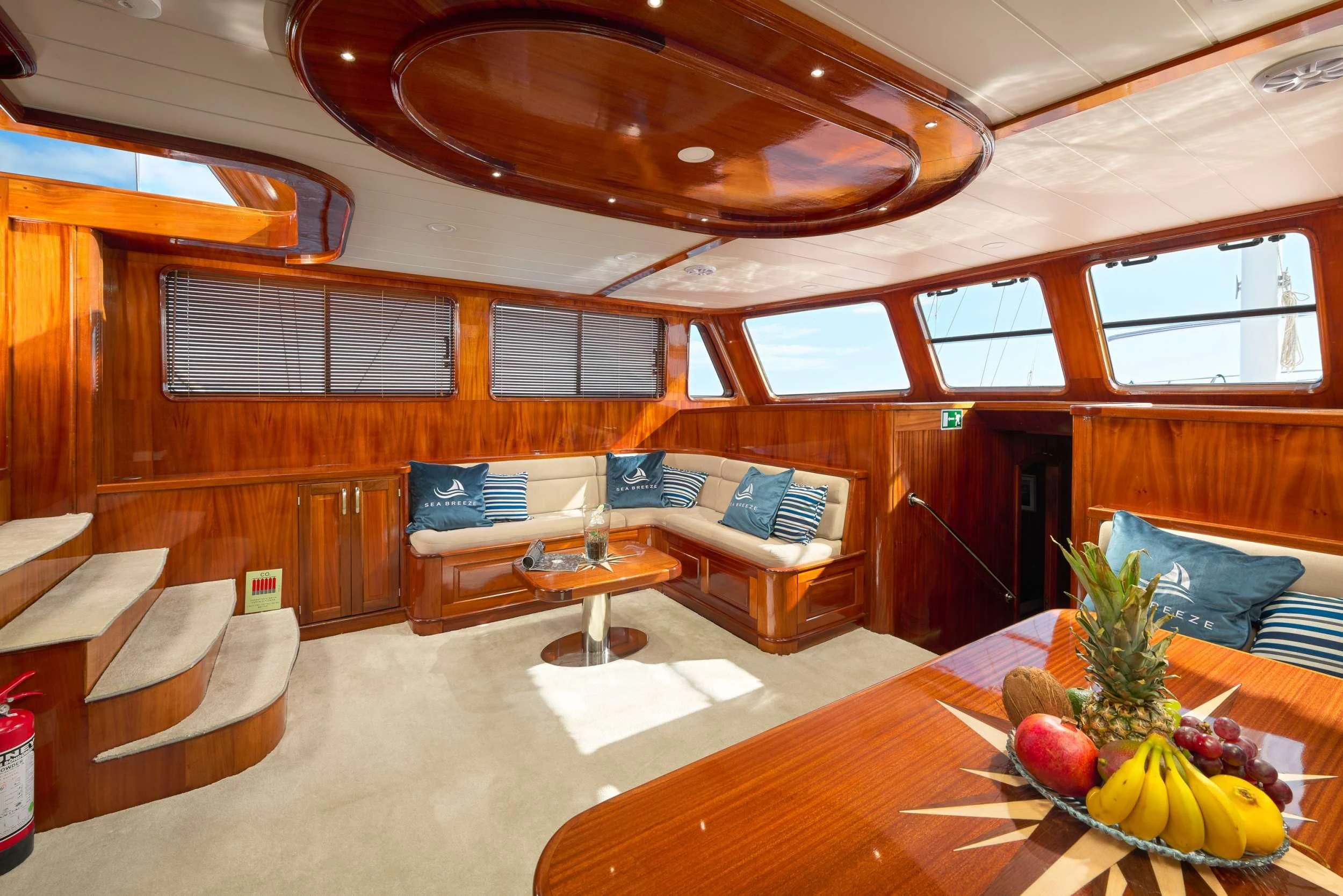 a living room with a couch and a table aboard SEA BREEZE Yacht for Charter