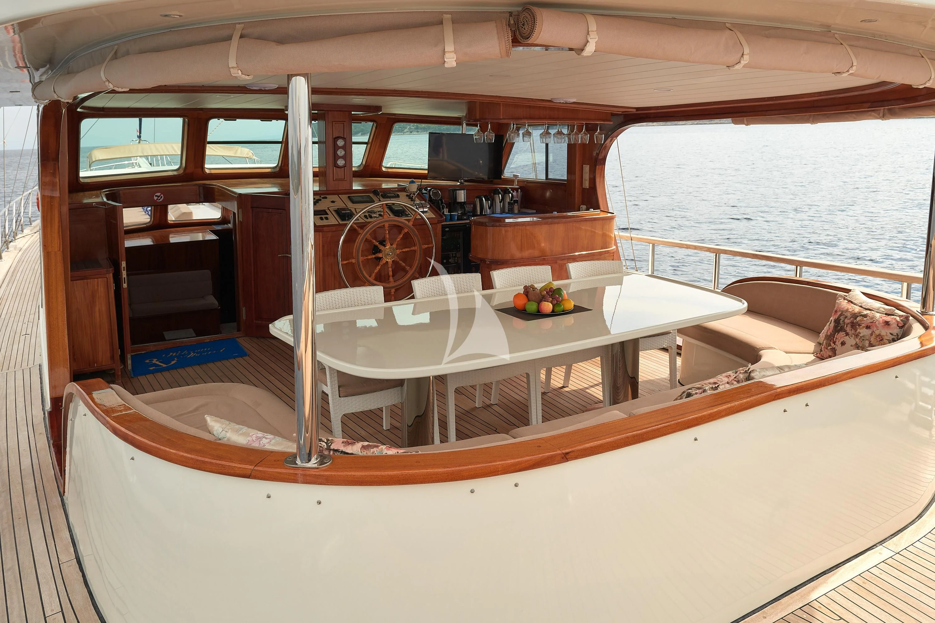 a boat with a table and chairs aboard SEA BREEZE Yacht for Charter
