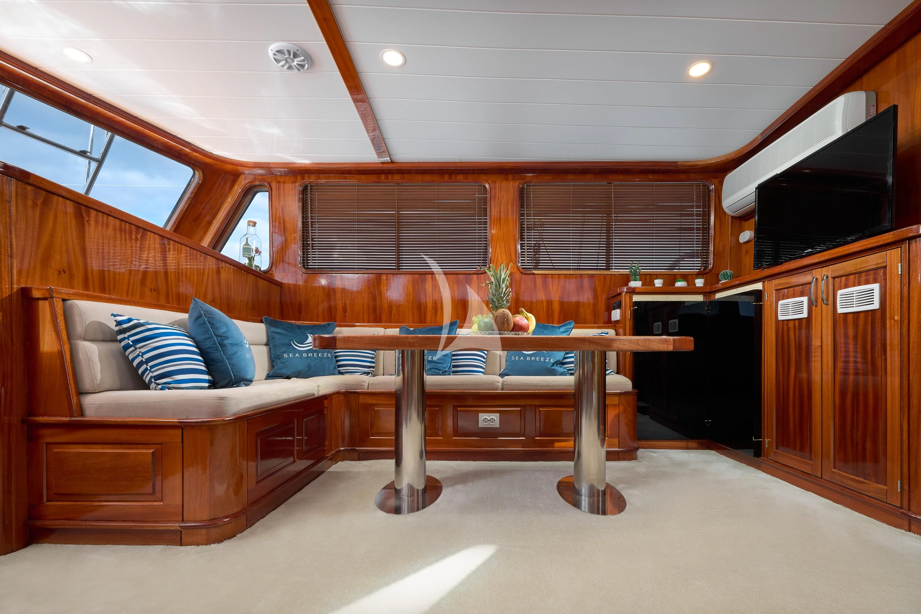 a living room with a couch and a table aboard SEA BREEZE Yacht for Charter