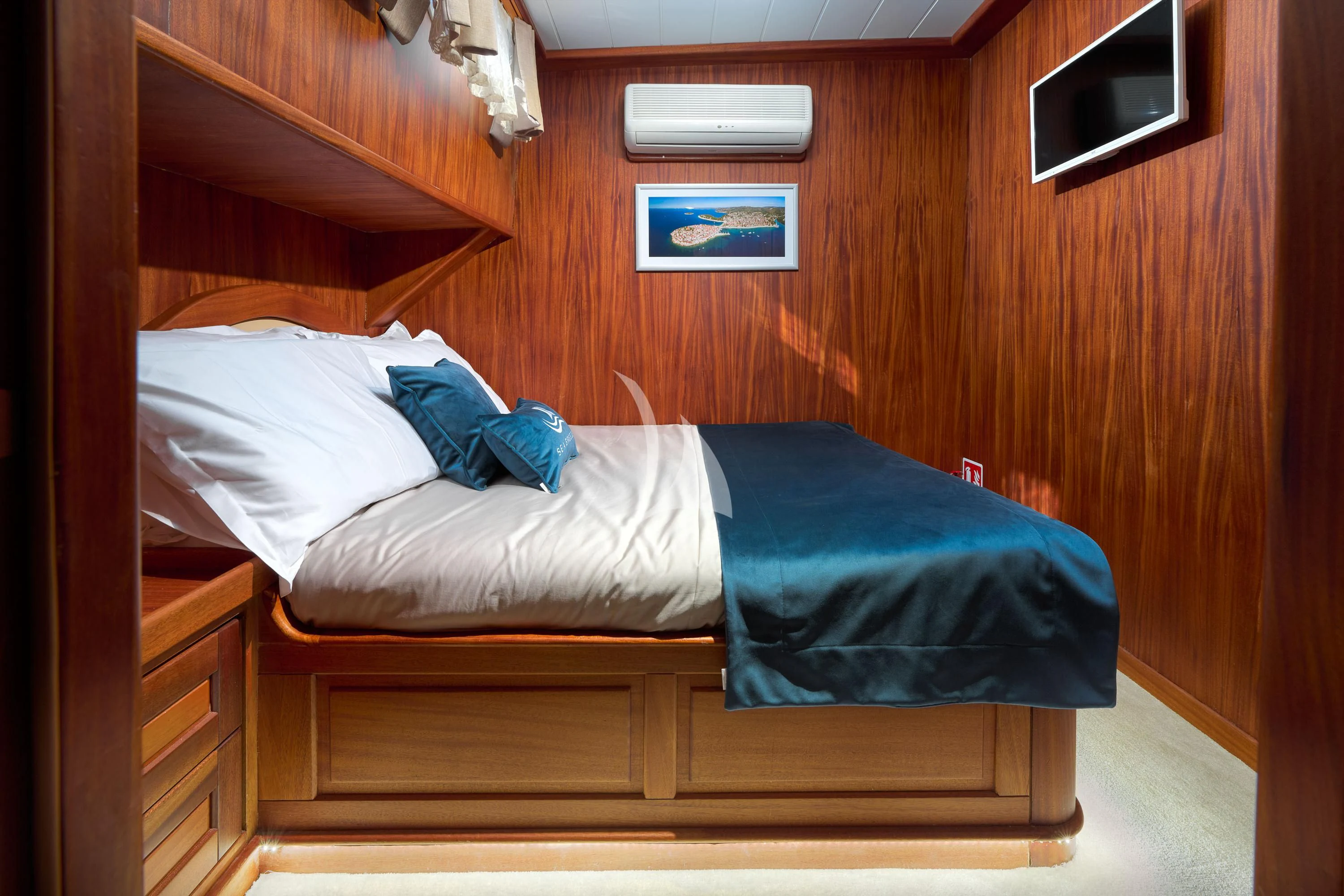 a couple of beds in a wooden room aboard SEA BREEZE Yacht for Charter