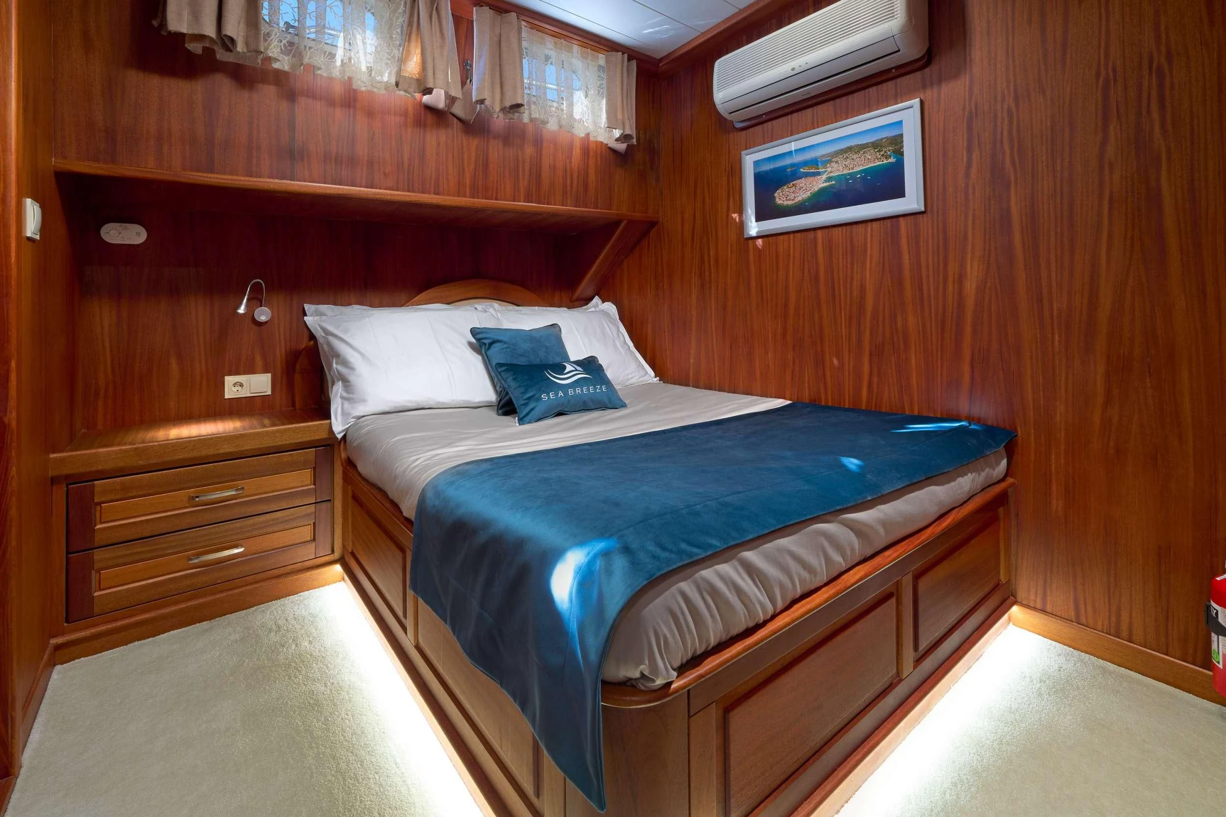 a bed in a room aboard SEA BREEZE Yacht for Charter