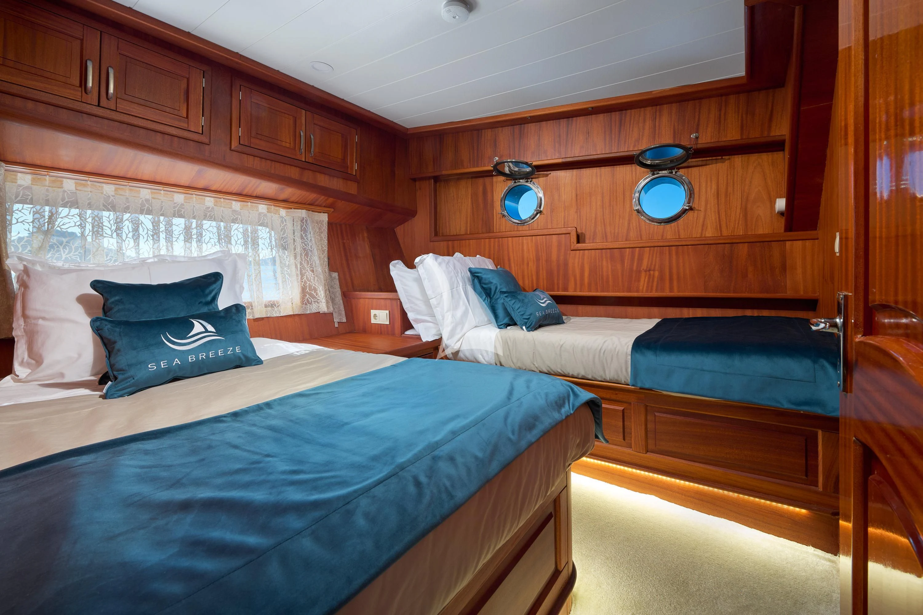 a couple of beds in a room aboard SEA BREEZE Yacht for Charter