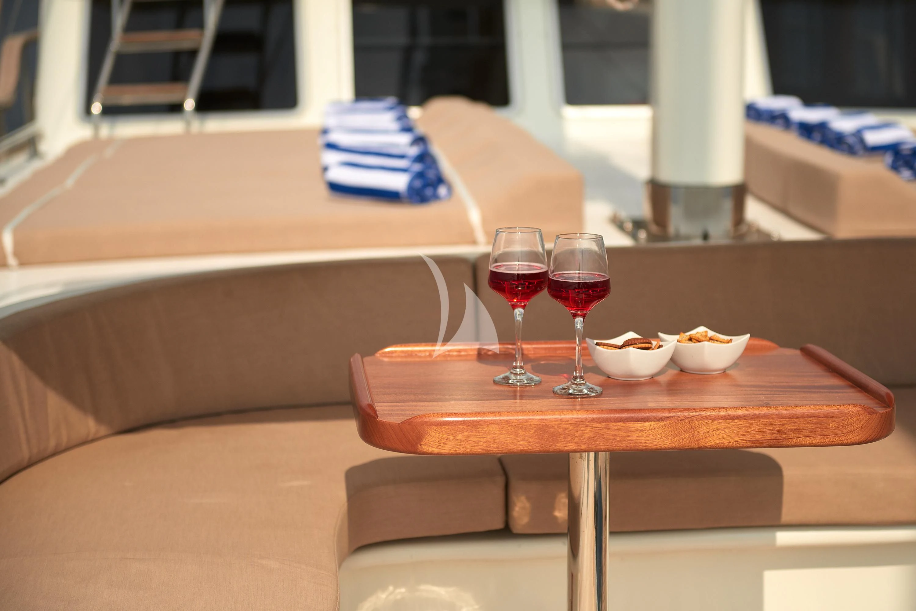 a table with glasses and food on it aboard SEA BREEZE Yacht for Charter
