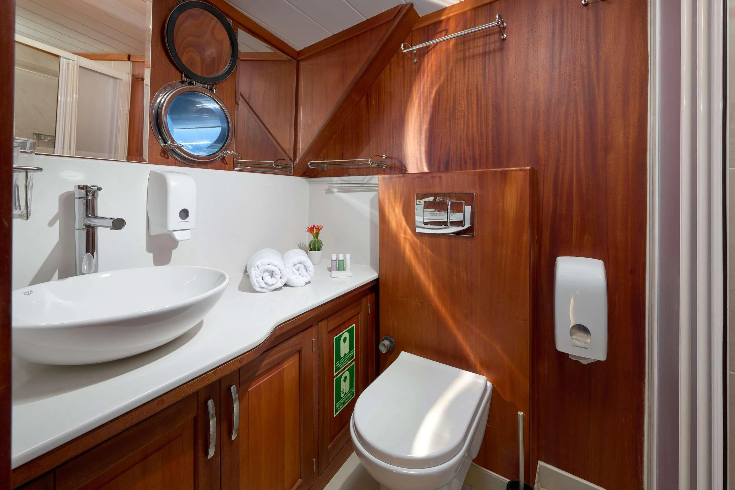 a bathroom with a toilet and sink aboard SEA BREEZE Yacht for Charter