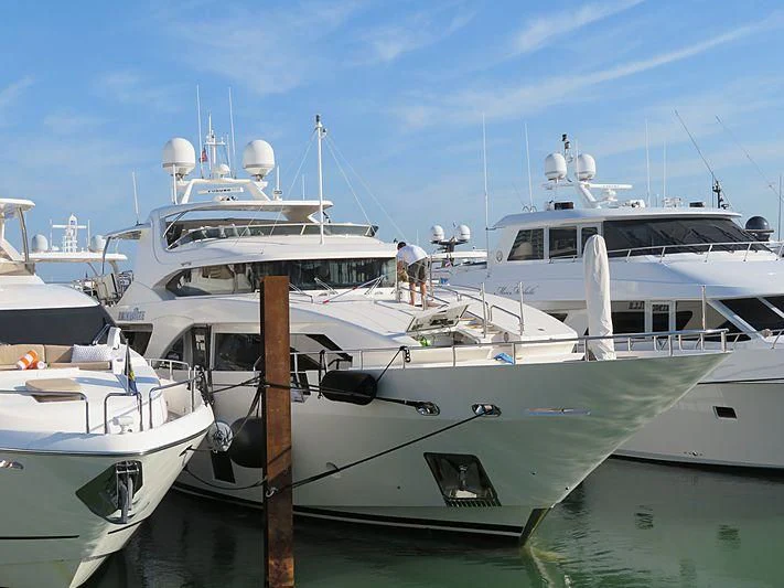 several boats docked at a pier aboard PIXY Yacht for Sale