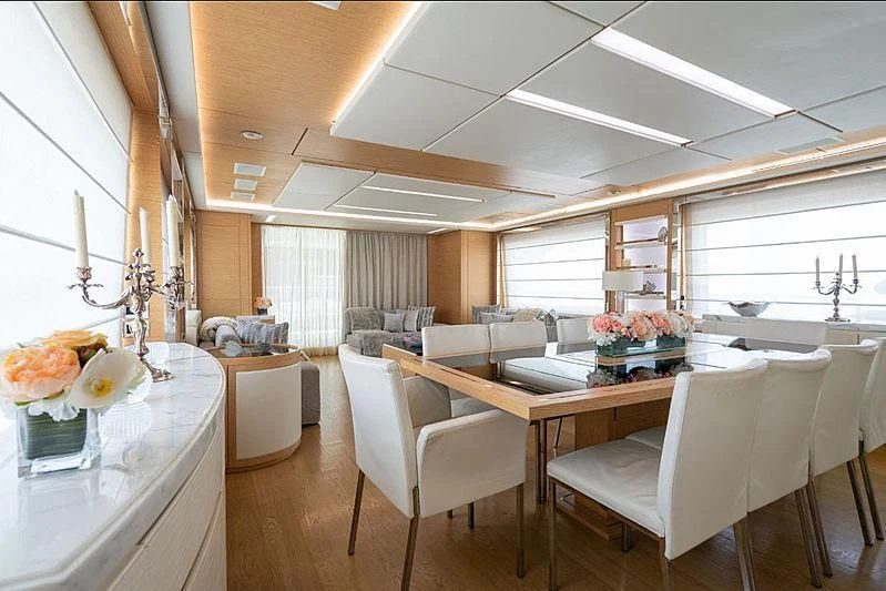 a kitchen with a table and chairs aboard PIXY Yacht for Sale