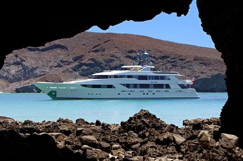 a boat on a rocky shore aboard MAISON BLANCHE Yacht for Charter