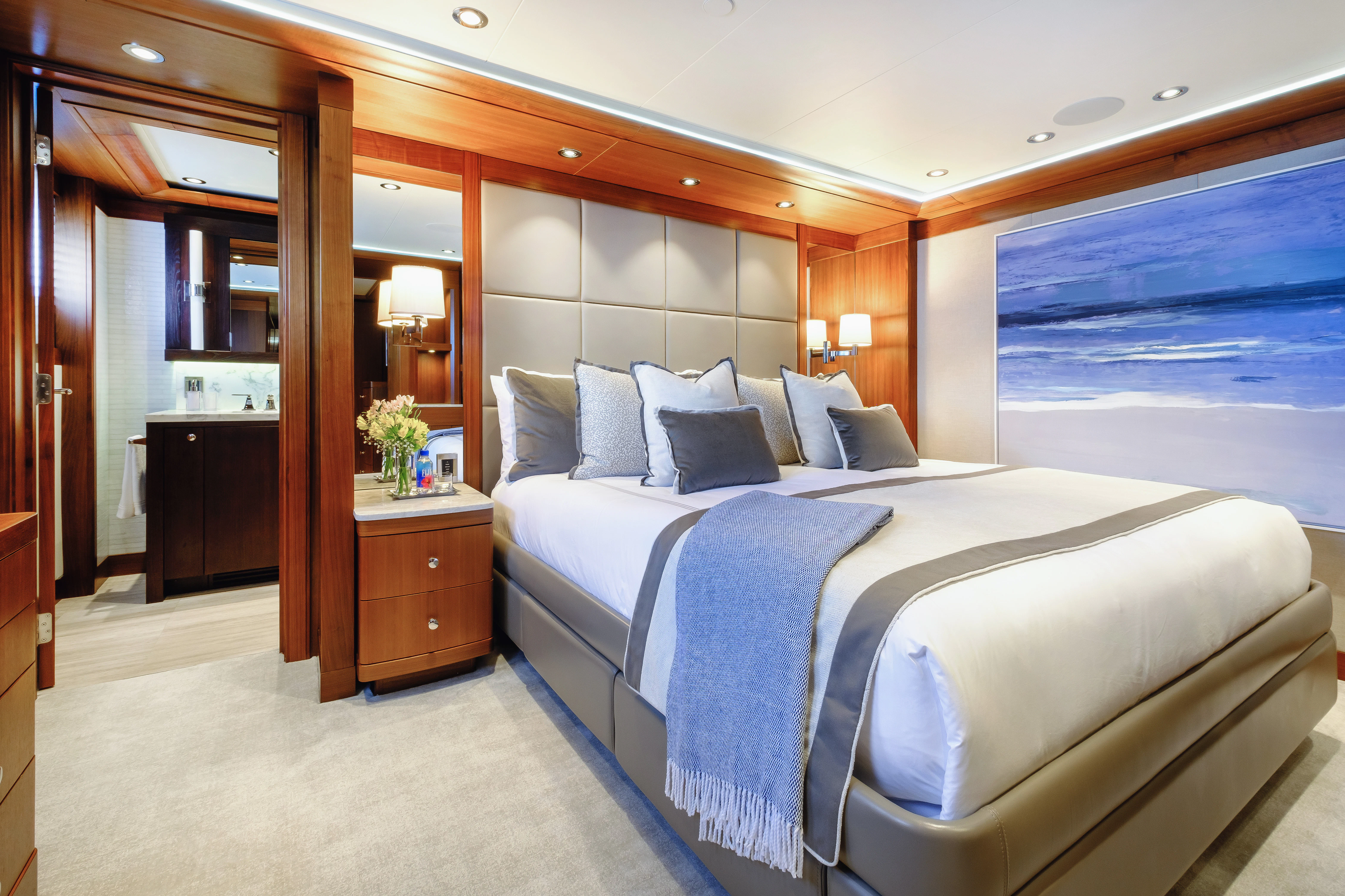 a hotel room with a large bed aboard MAISON BLANCHE Yacht for Charter
