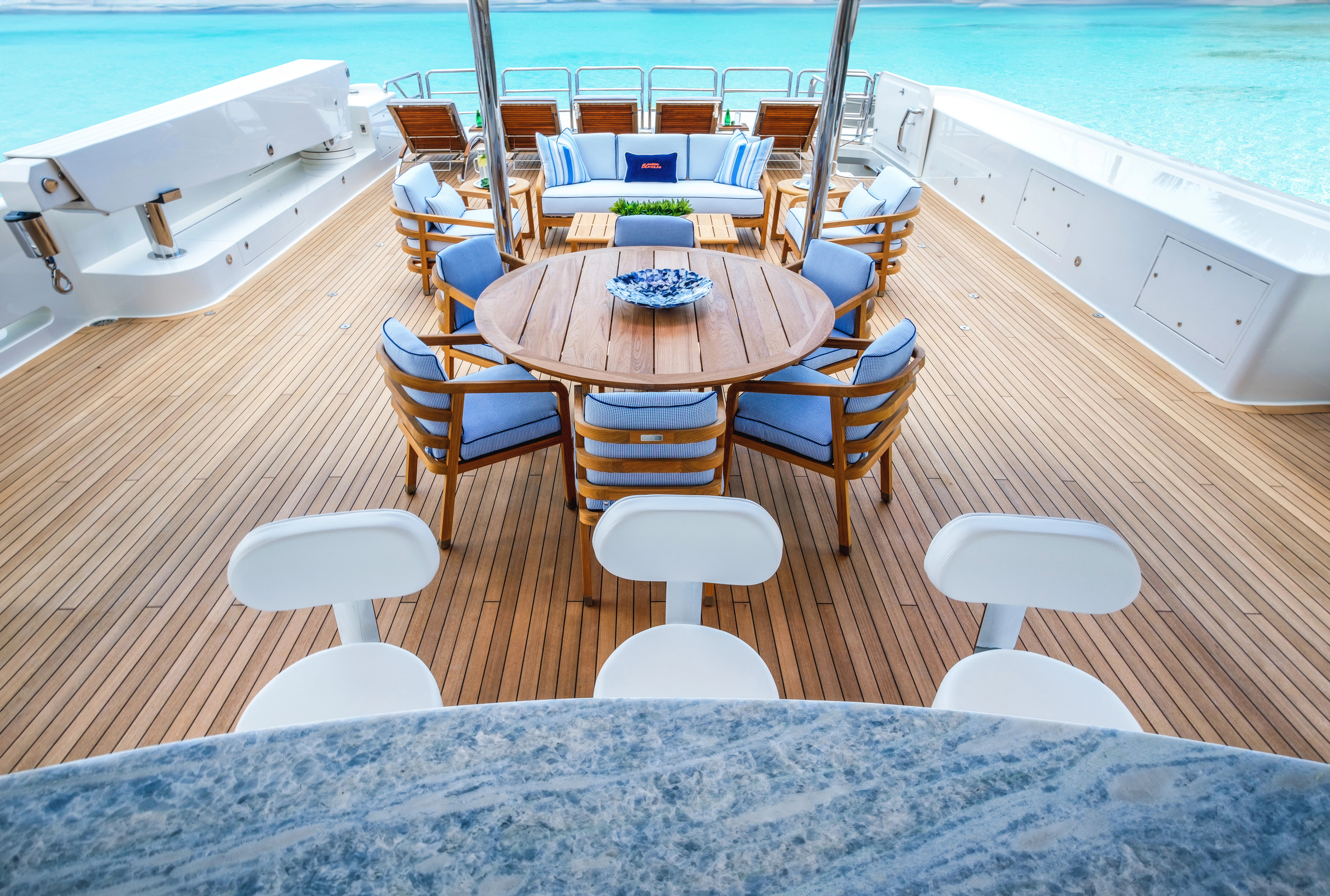 a table and chairs on a boat aboard MAISON BLANCHE Yacht for Charter