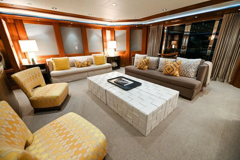 a living room with a couch and a table aboard MAISON BLANCHE Yacht for Charter