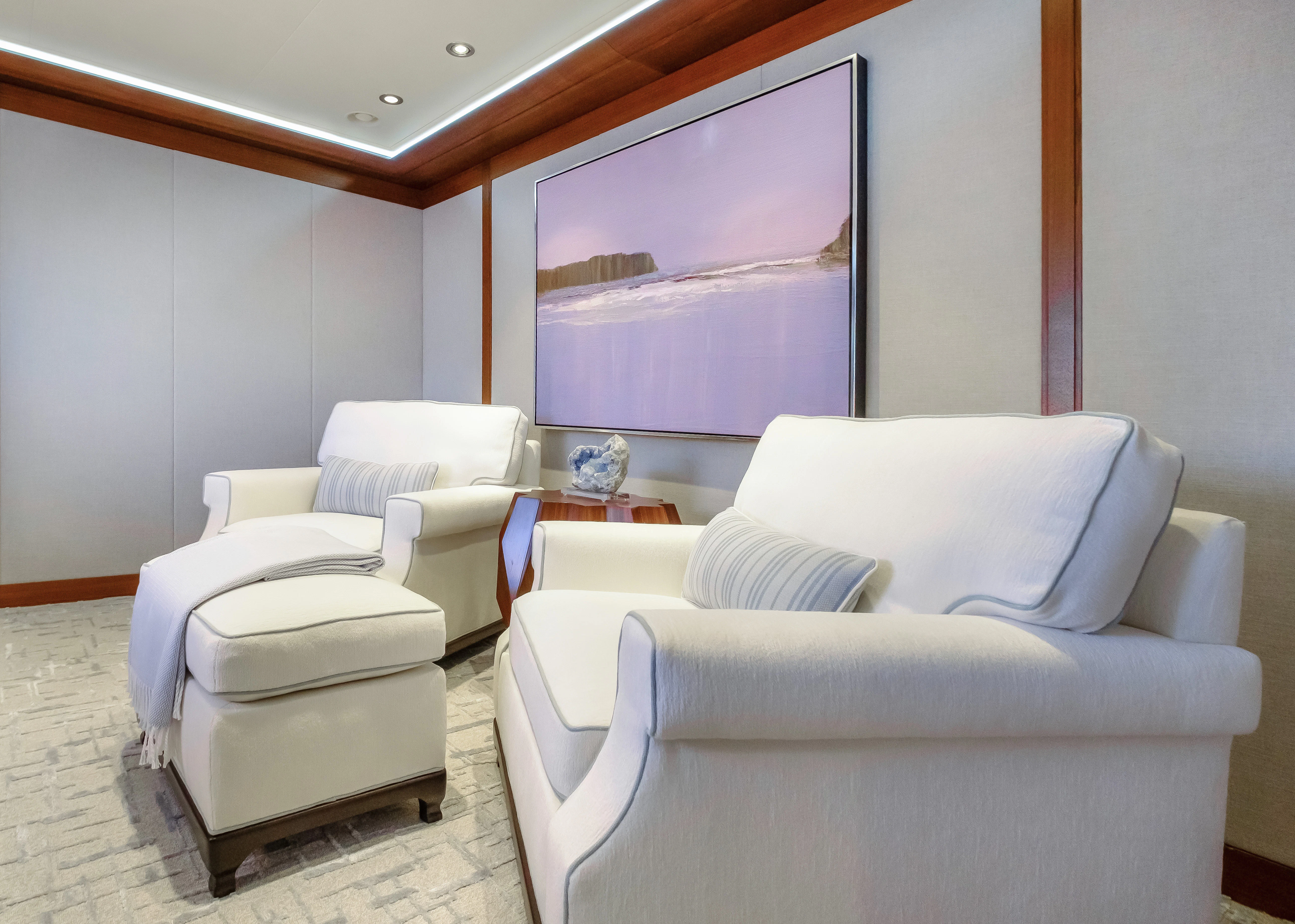 a room with white couches aboard MAISON BLANCHE Yacht for Charter