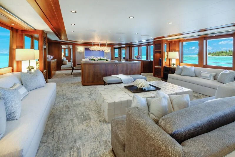 a living room with a large window aboard MAISON BLANCHE Yacht for Charter