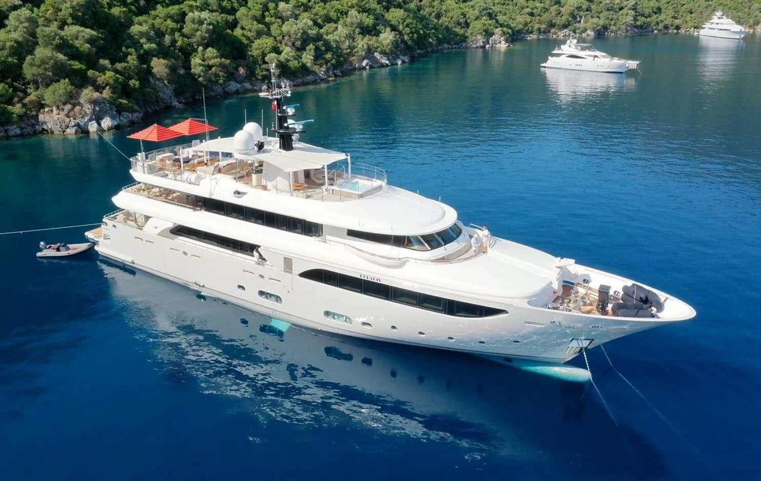 a white yacht in the water aboard PHOTON Yacht for Sale