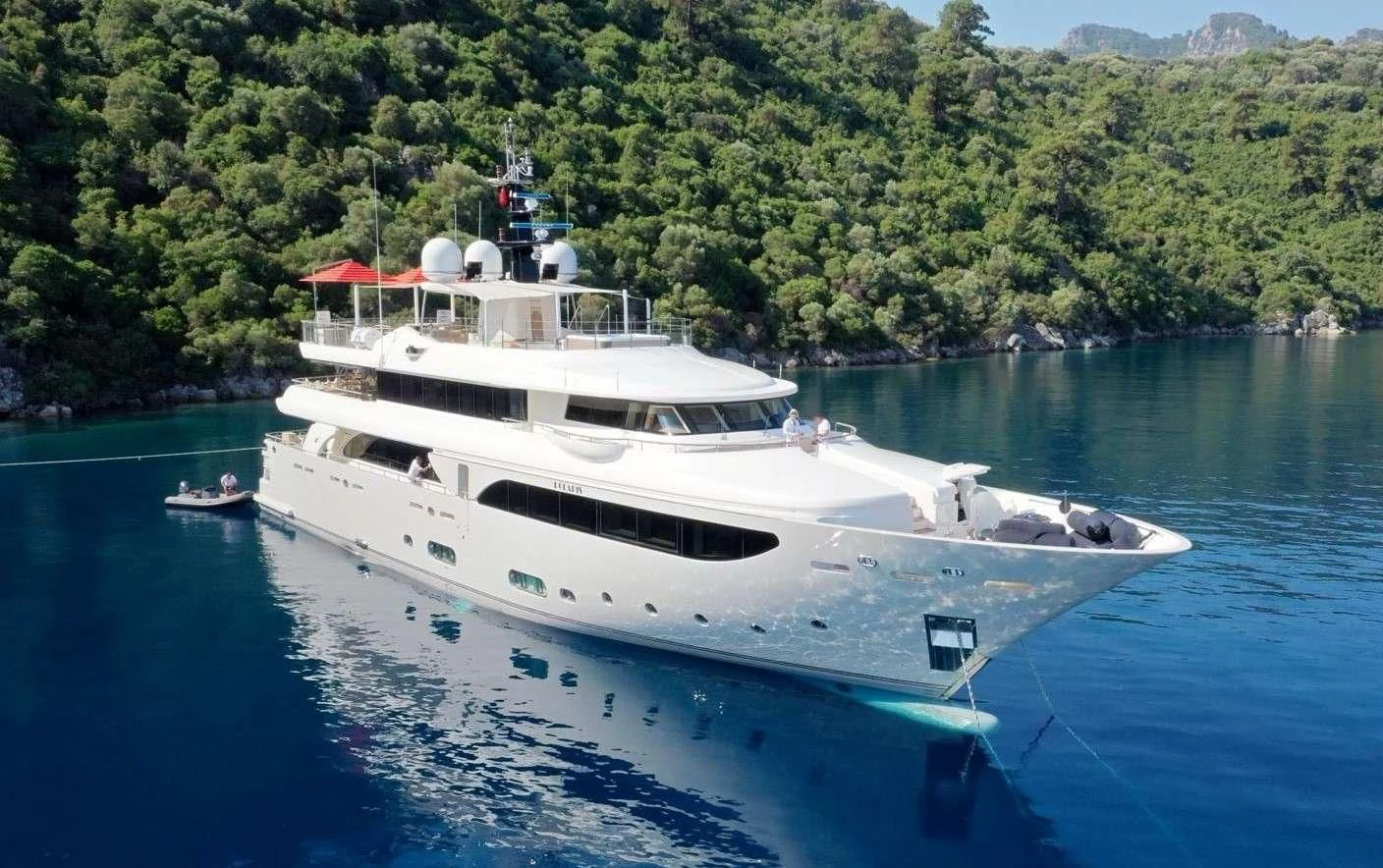 a large white boat on the water aboard PHOTON Yacht for Sale