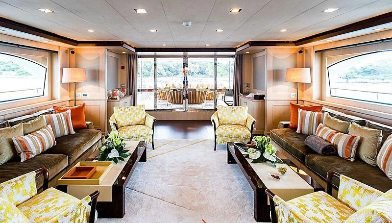 a living room with a large window aboard PHOTON Yacht for Sale