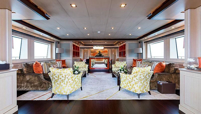 a living room with a large window aboard PHOTON Yacht for Sale