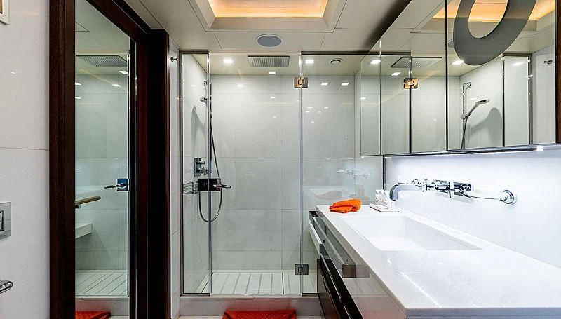 a bathroom with a glass shower aboard PHOTON Yacht for Sale