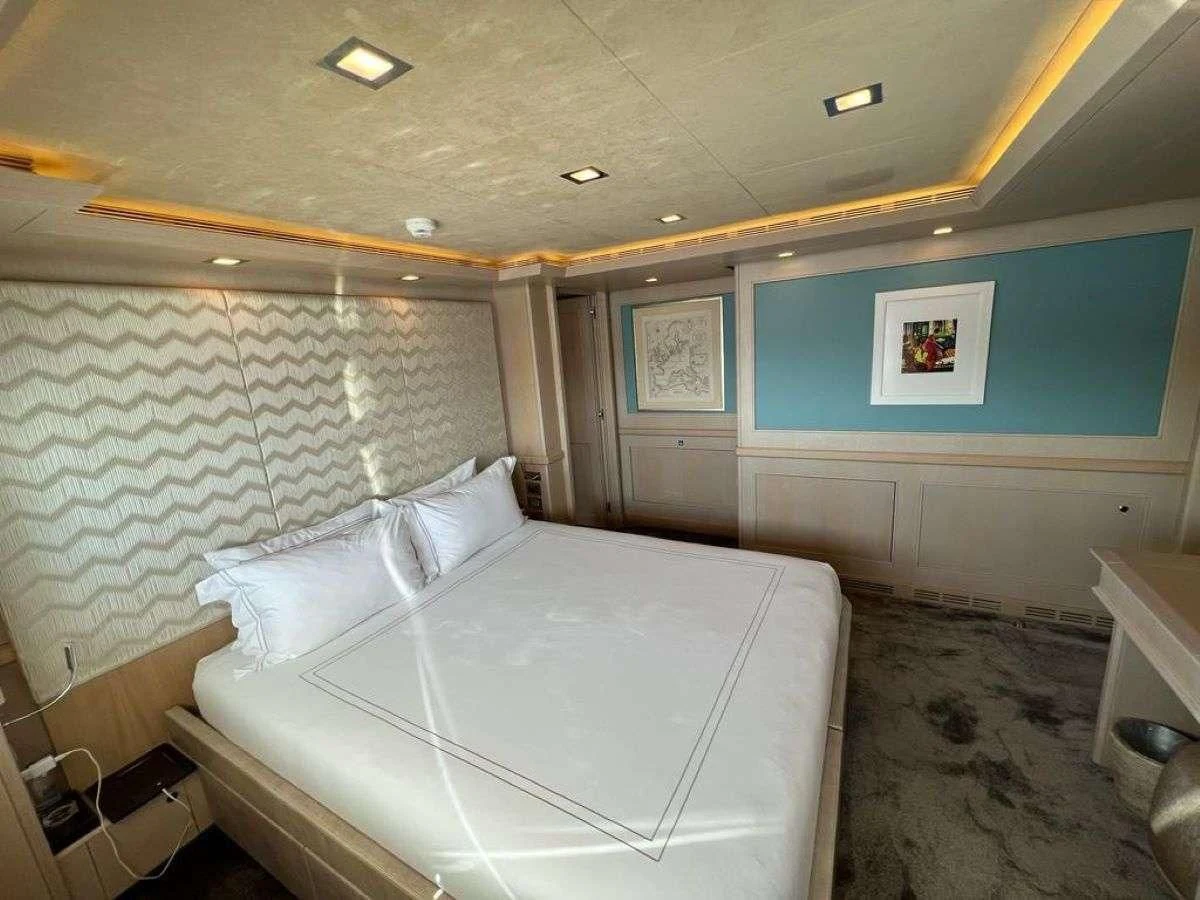 a room with two beds aboard PHOTON Yacht for Sale