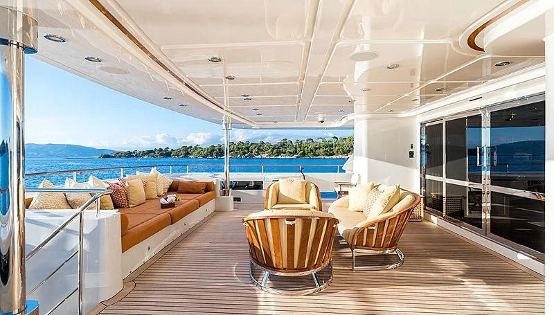 a living room with a view of the ocean aboard PHOTON Yacht for Sale