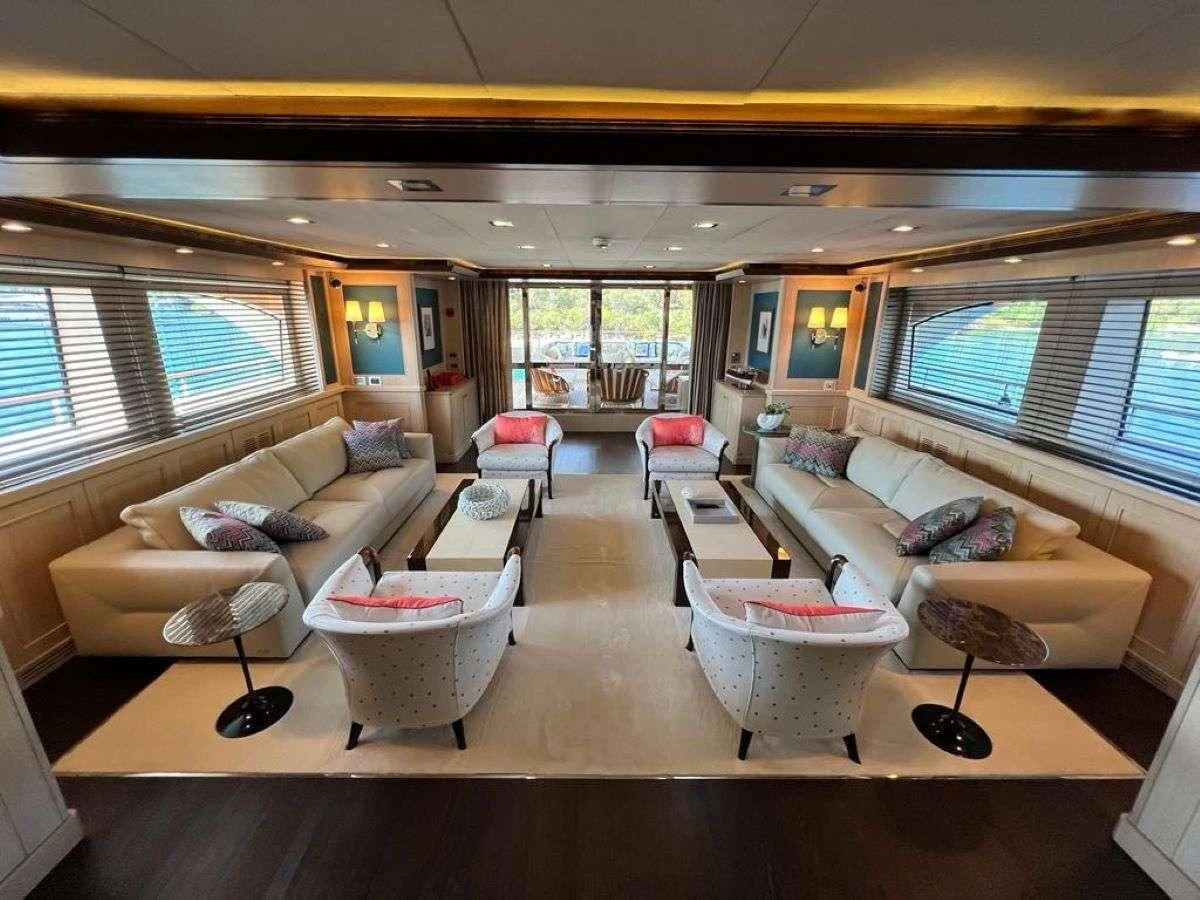 a living room with a large window aboard PHOTON Yacht for Sale